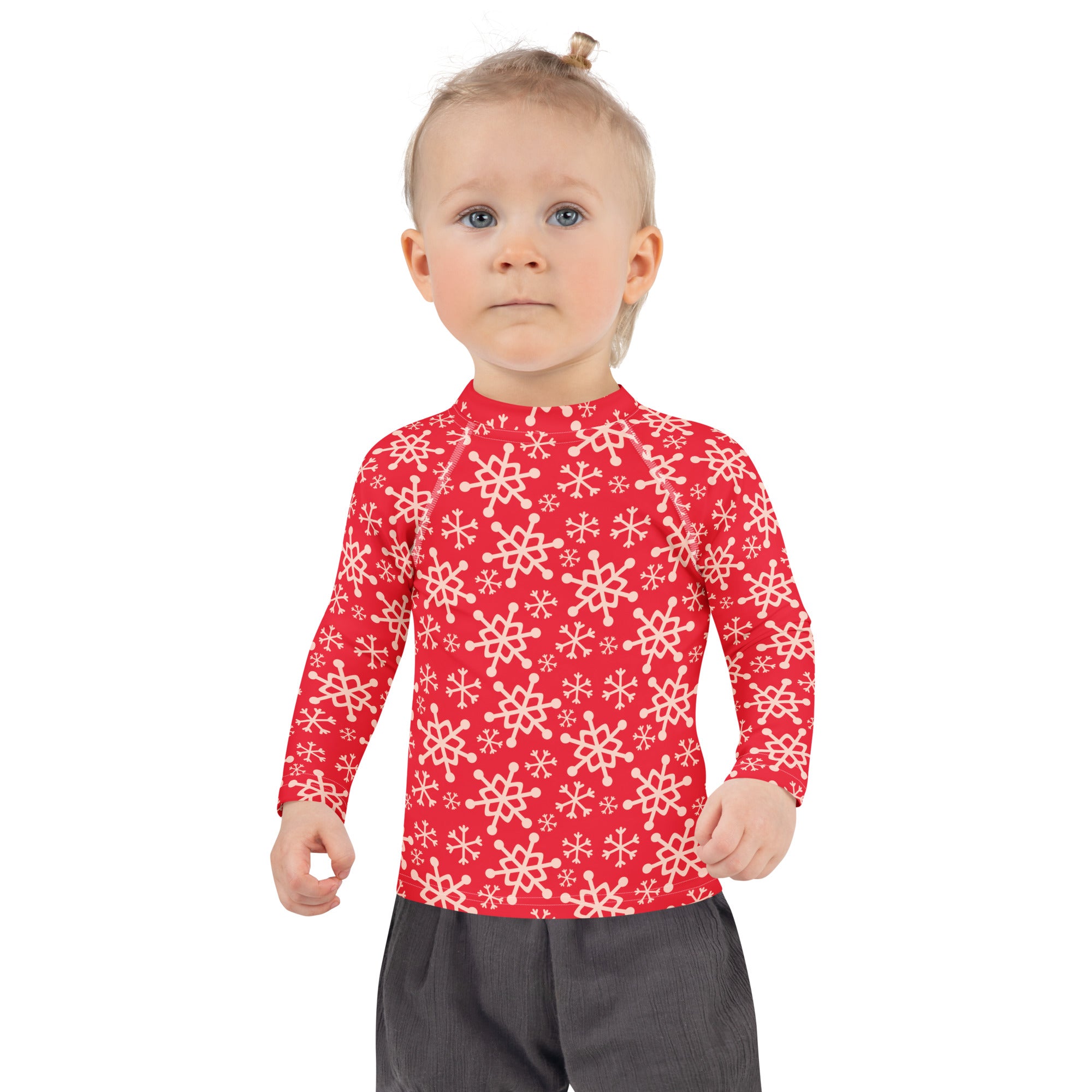 Kids red long-sleeved rash guard swim shirt with white snowflake pattern and UPF 50 plus for sun protection