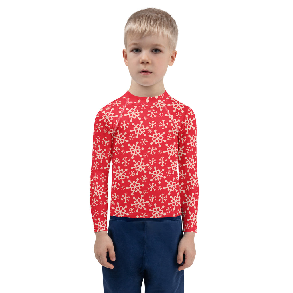 Kids red long sleeve rash guard swim shirt with white snowflake patterns and upf 50 plus sun protection