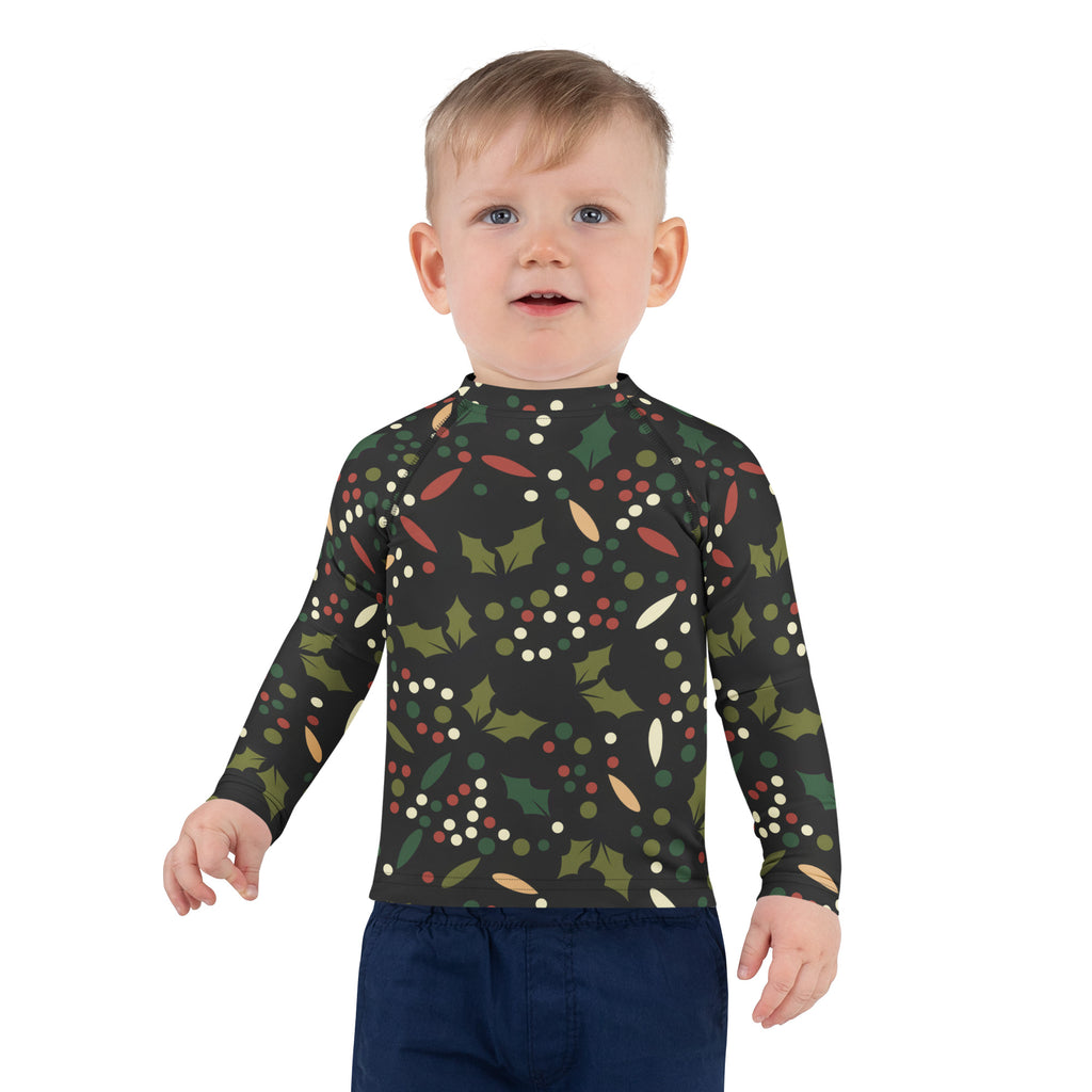 Kids black long sleeve rash guard swim shirt with UPF 50+ featuring festive holly leaves red and white berries pattern
