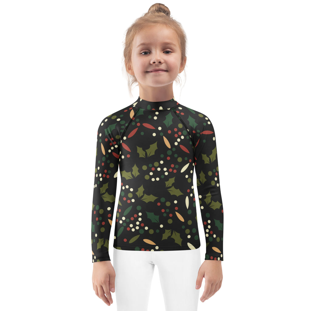 Black kids long sleeve rash guard with festive green holly leaves red and white berries gold accents and UPF 50+ protection