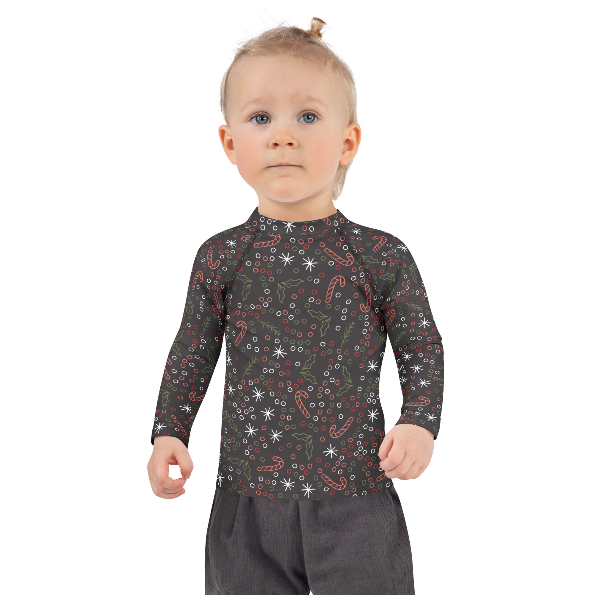Black long-sleeved kids rash guard swim shirt with candy cane and holly pattern and upf 50+ sun protection