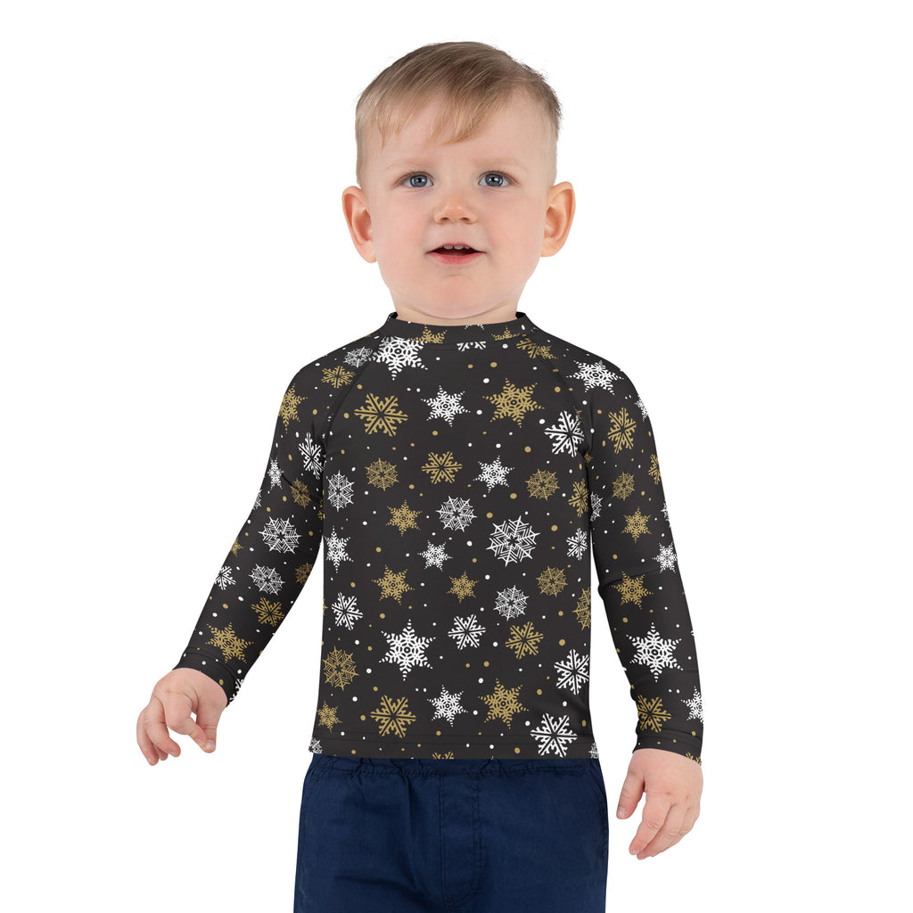 Black long-sleeved kids rash guard swim shirt with white and gold snowflakes and UPF 50+ protection