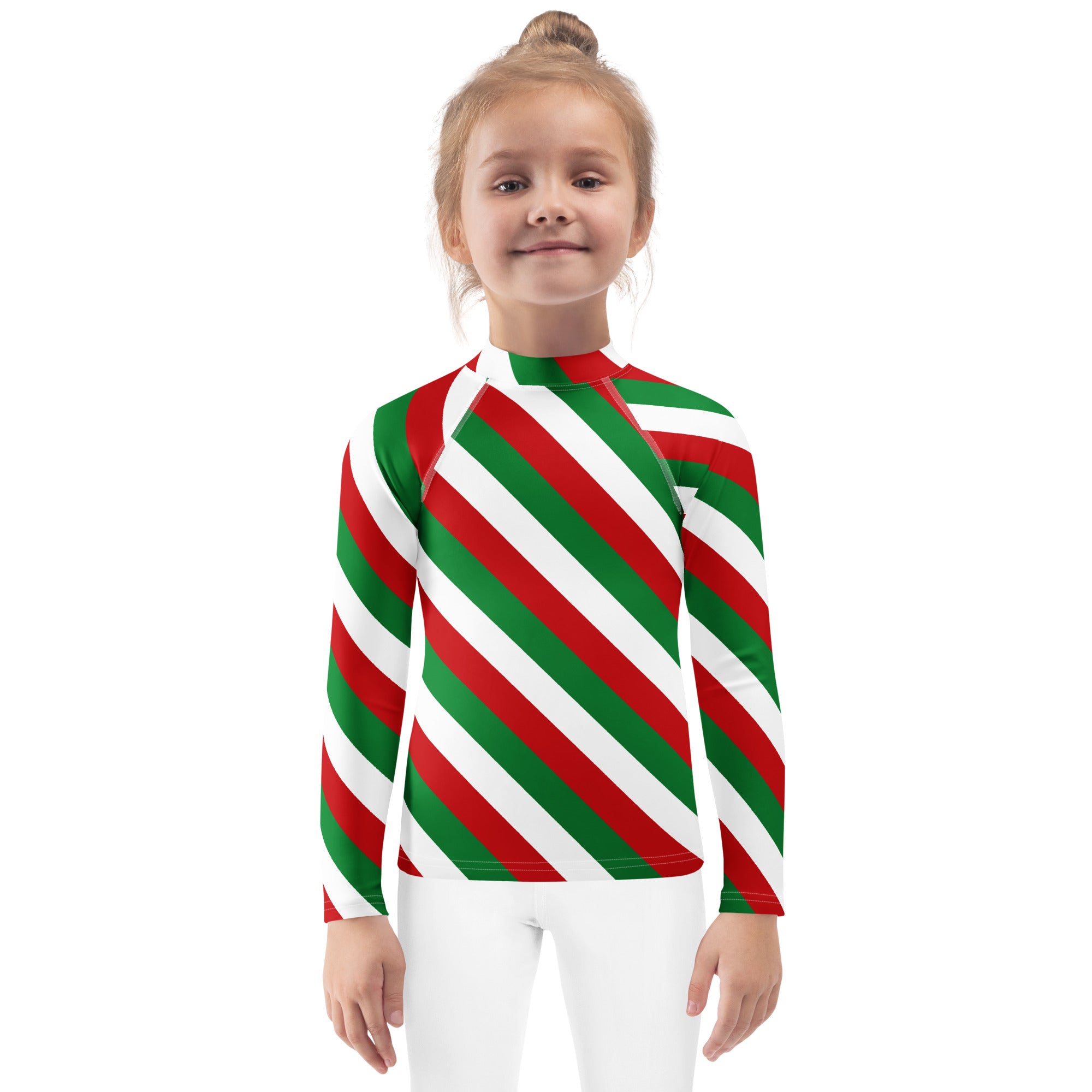 A child wearing a kids bold candy cane stripe christmas long sleeve rash guard swim shirt with upf 50+ in red green and white