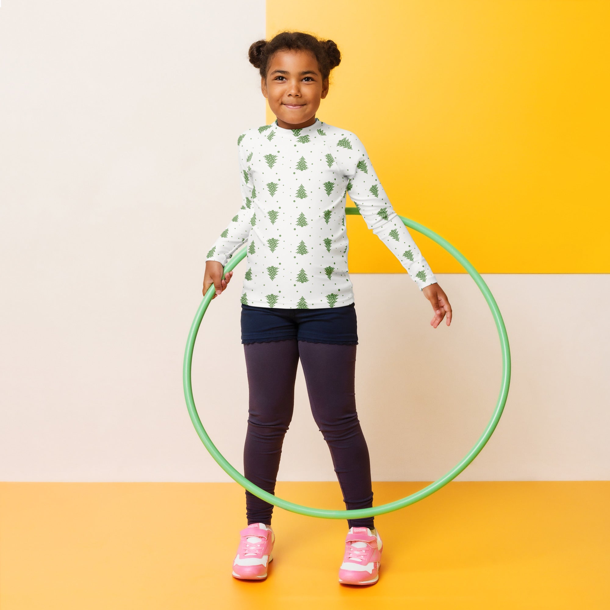 Green plastic hula hoop paired with kids christmas tree long sleeve rash guard swim shirt with upf 50+