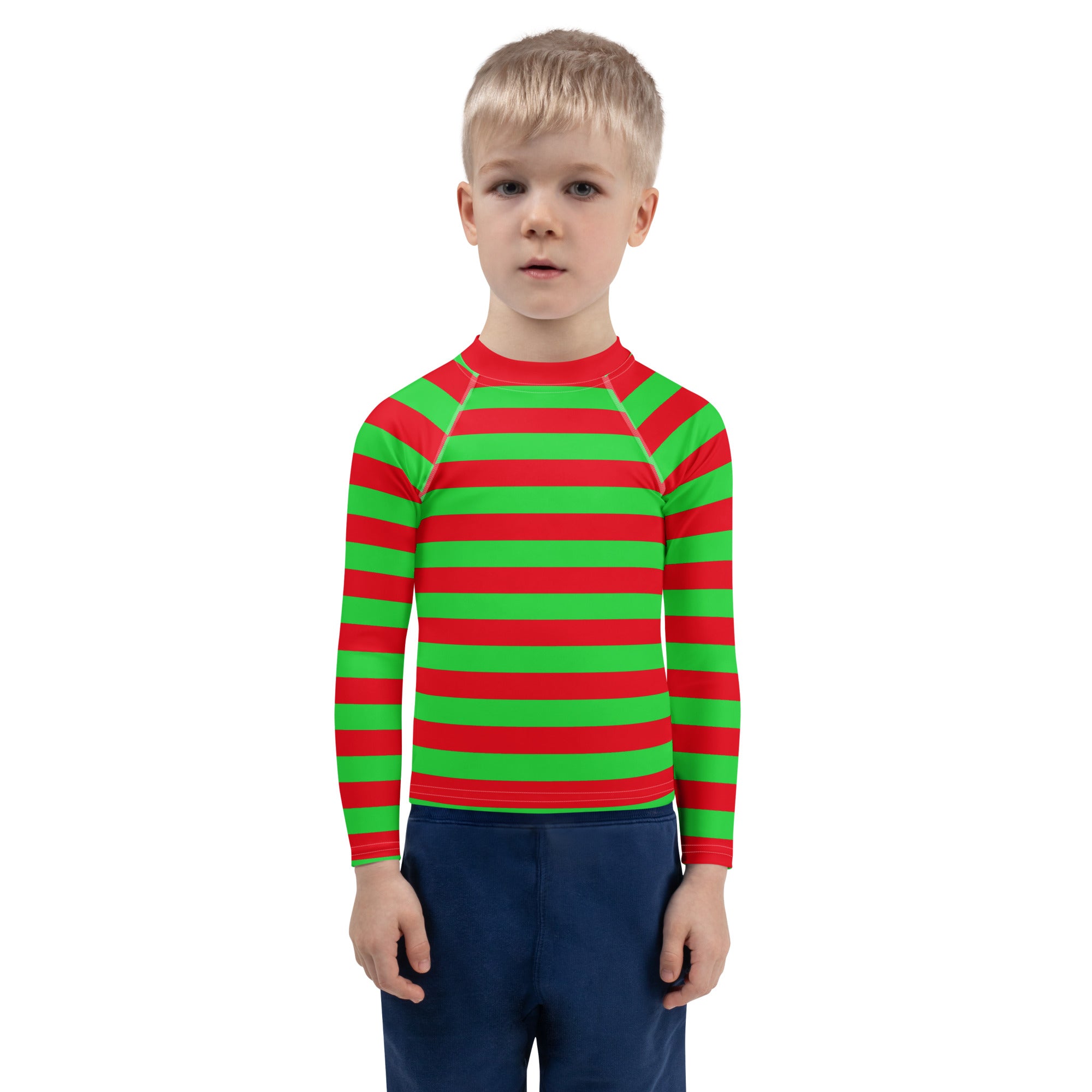 A child wearing a kids red and green striped long sleeve rash guard swim shirt with UPF 50 plus protection