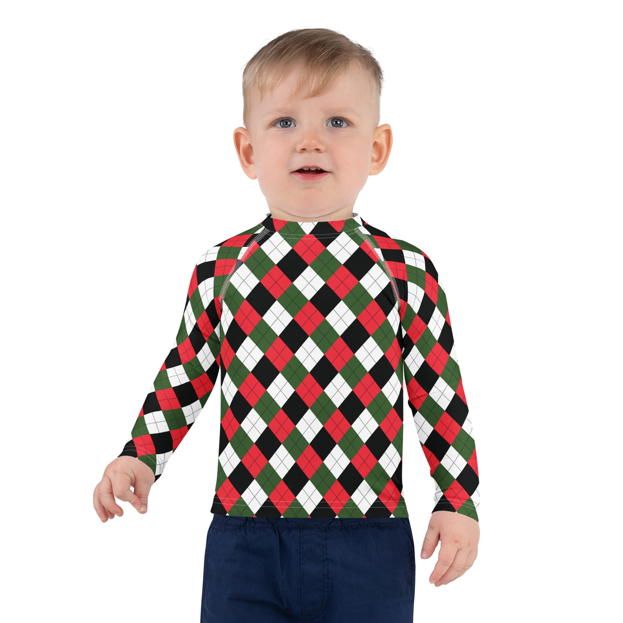 A child wearing a kids Christmas argyle long sleeve rash guard swim shirt with red green black white pattern and UPF 50+