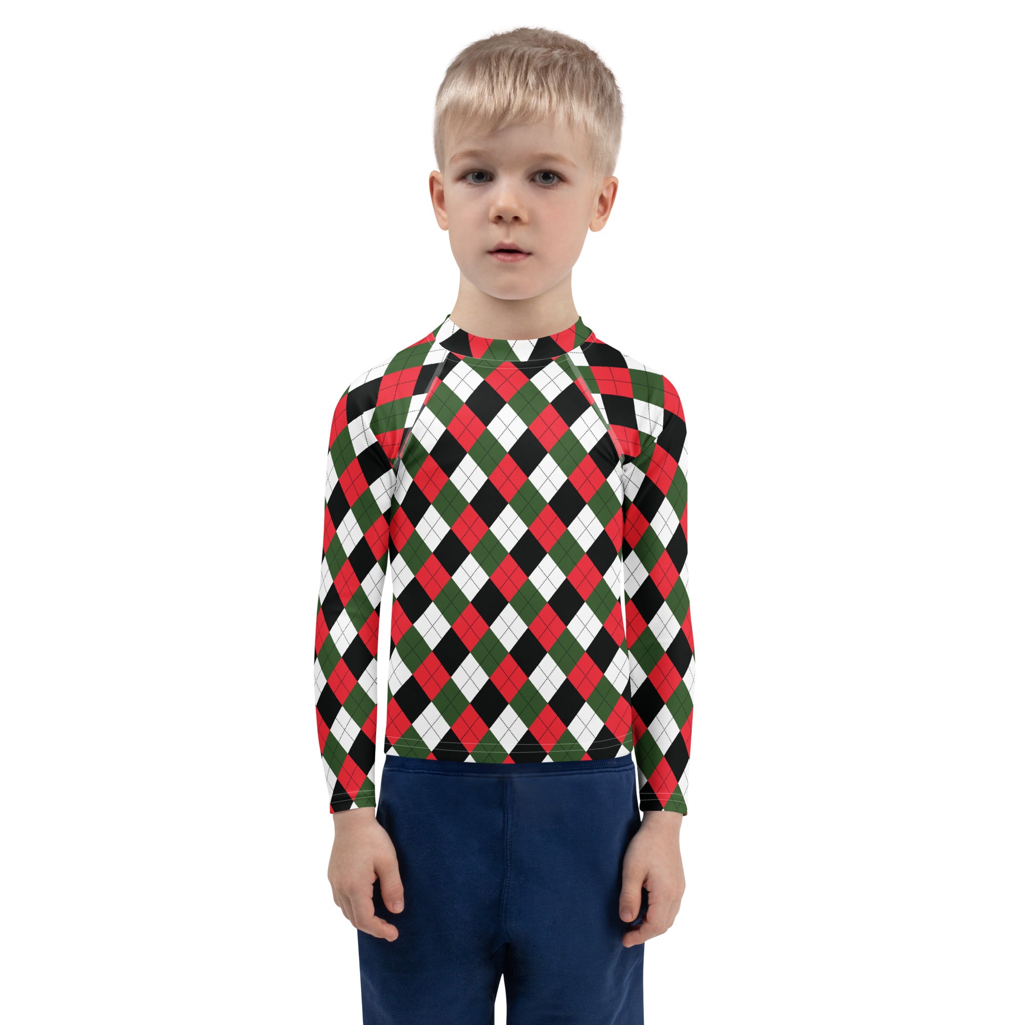 A child wearing a kids christmas argyle long sleeve rash guard with upf 50 plus in red green and black