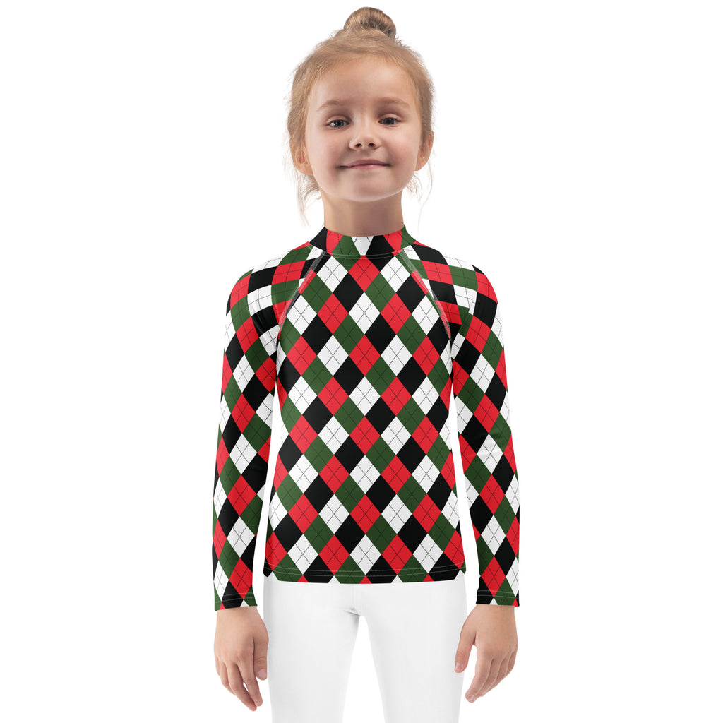 A child wearing a kids christmas argyle long sleeve rash guard swim shirt with upf 50 plus in red green and black