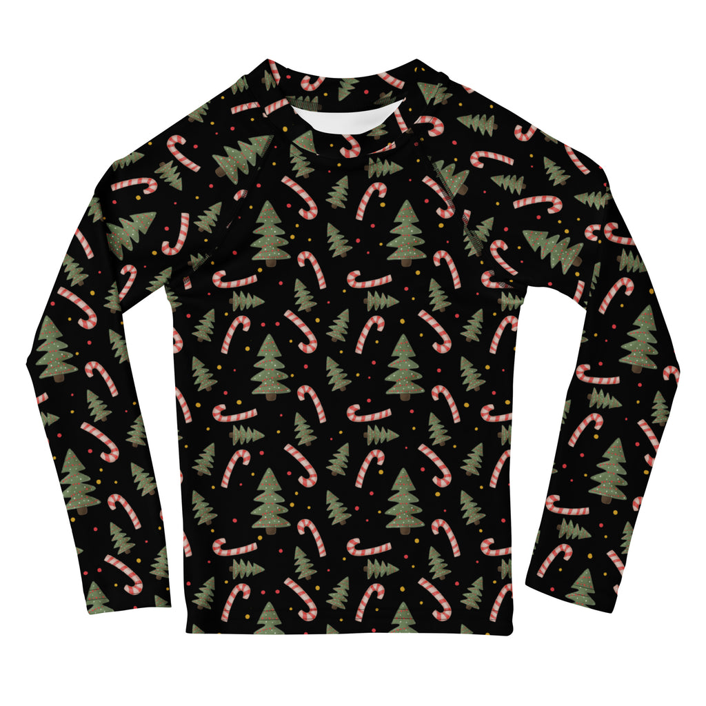 Kids candy cane and christmas tree long sleeve rash guard swim shirt in black with festive green pine trees and pink candy canes