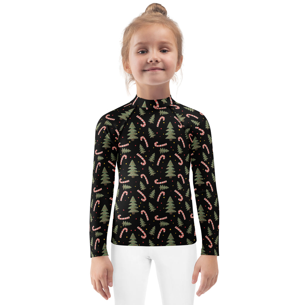 Black long-sleeved kids rash guard with pink candy canes and green pine trees featuring UPF 50 plus protection