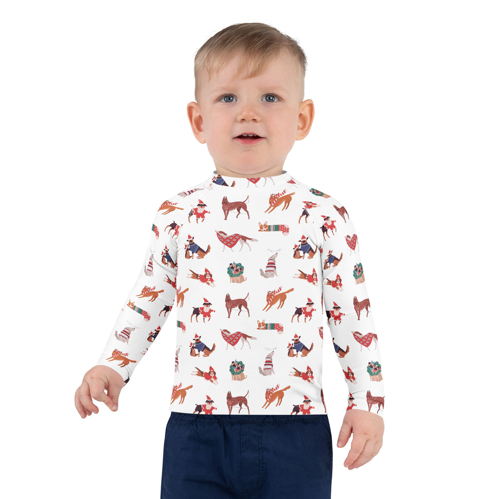 White long-sleeve kids rash guard swim shirt with festive red brown green dog illustrations and upf 50+ protection