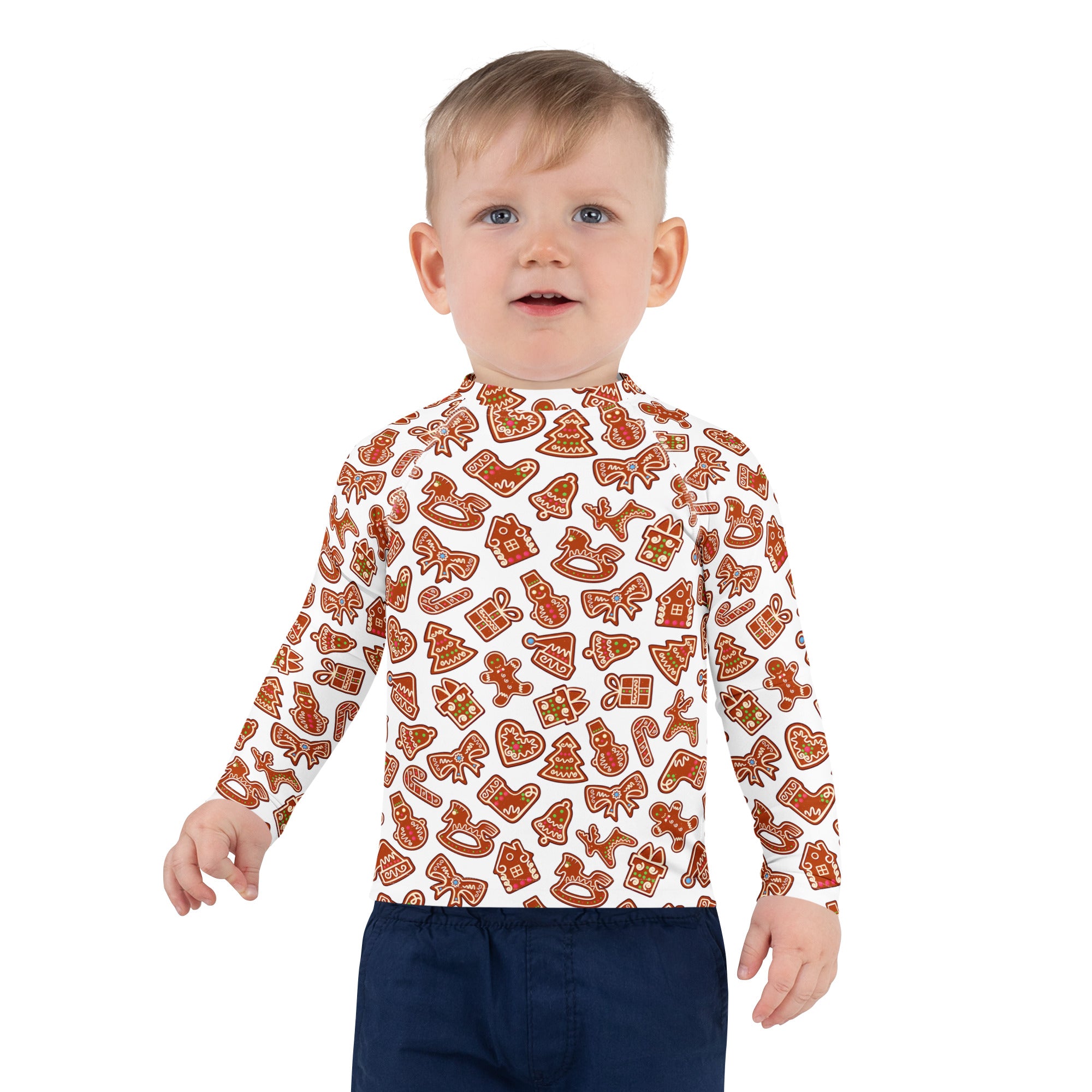 A child wearing a white long sleeve kids gingerbread cookie rash guard swim shirt with upf 50 plus protection