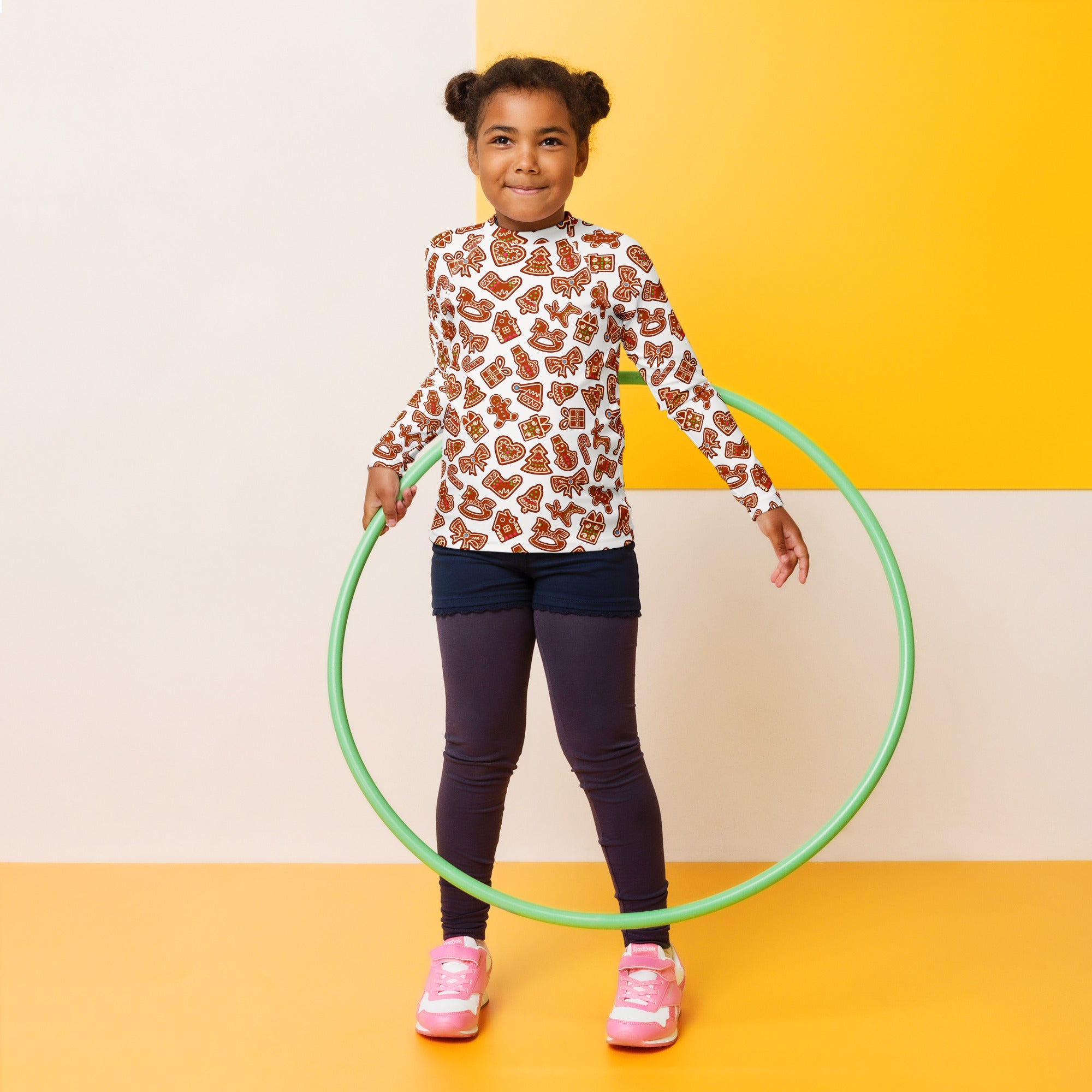 Green plastic hula hoop shown with kids gingerbread cookie long sleeve rash guard swim shirt with upf 50+