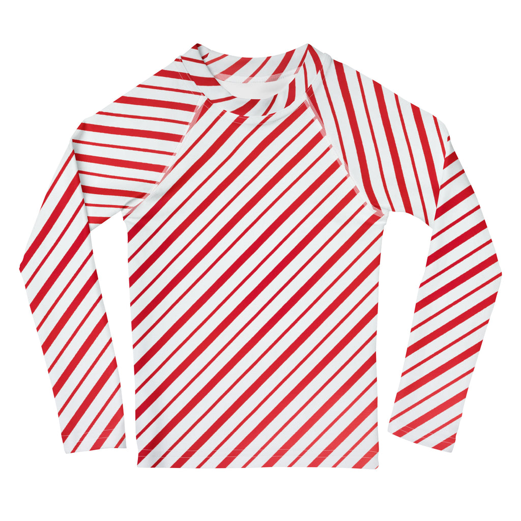 Kids red and white candy cane striped long sleeve rash guard made of stretchy moisture-wicking fabric with UPF 50+
