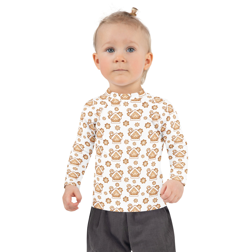 White long-sleeved kids rash guard swim shirt with brown gingerbread house pattern and upf 50+ sun protection