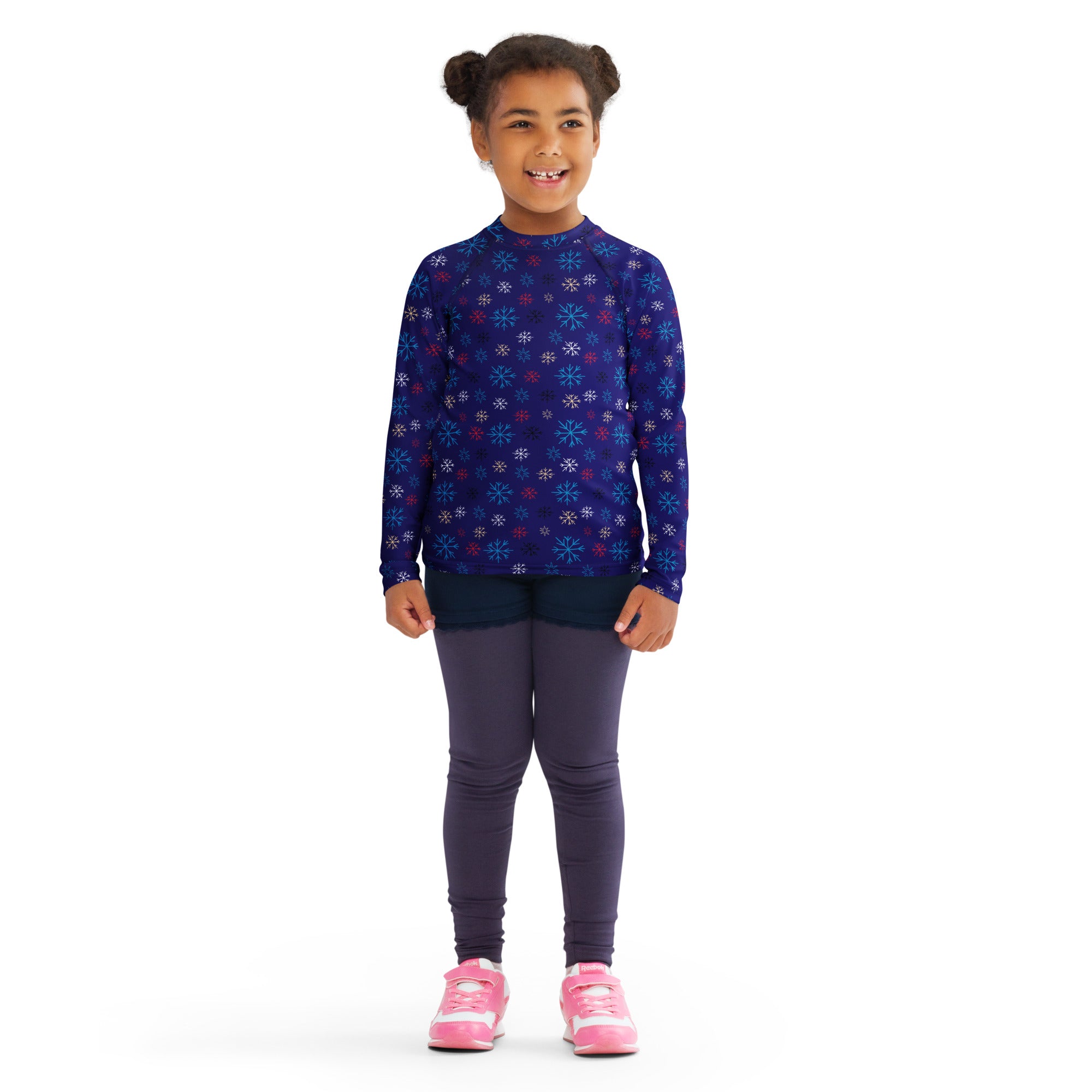 A child wearing a kids navy snowflake Christmas long sleeve rash guard swim shirt with UPF 50+ protection