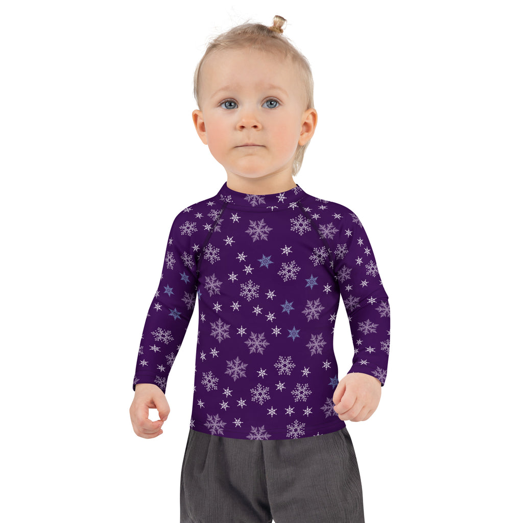 Kids purple long sleeve rash guard swim shirt with white and light blue snowflake pattern and upf 50+ protection