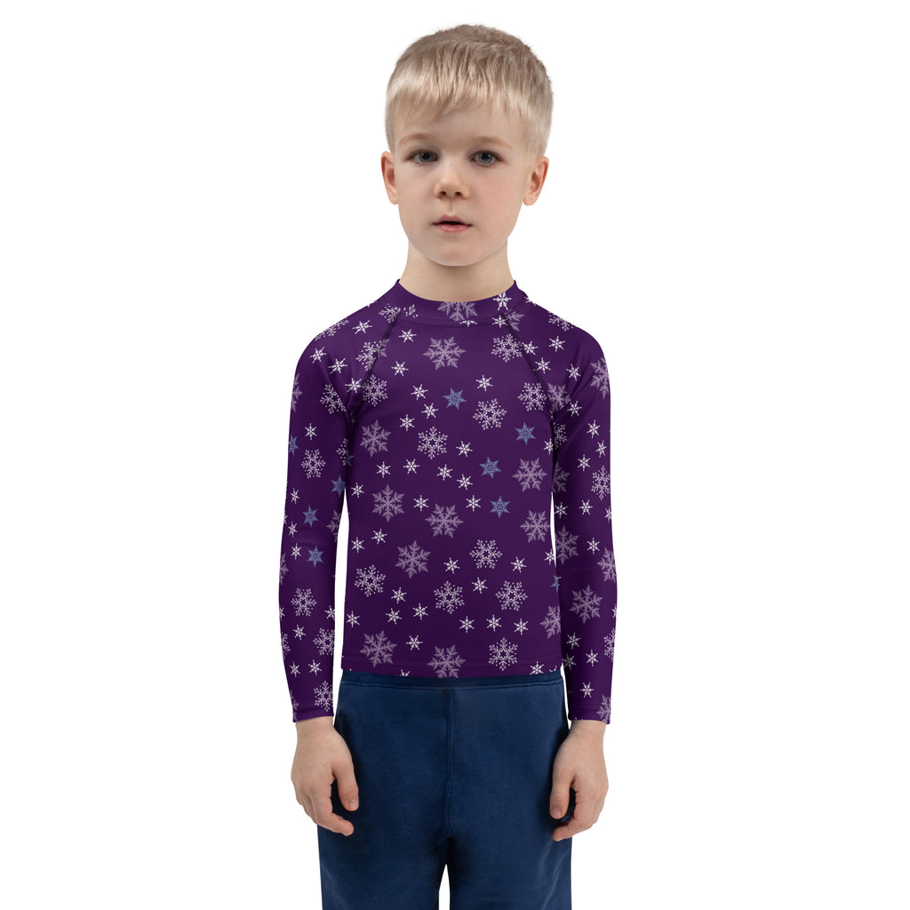 Kids purple long sleeve rash guard swim shirt with white and light blue snowflake pattern and UPF 50 plus protection