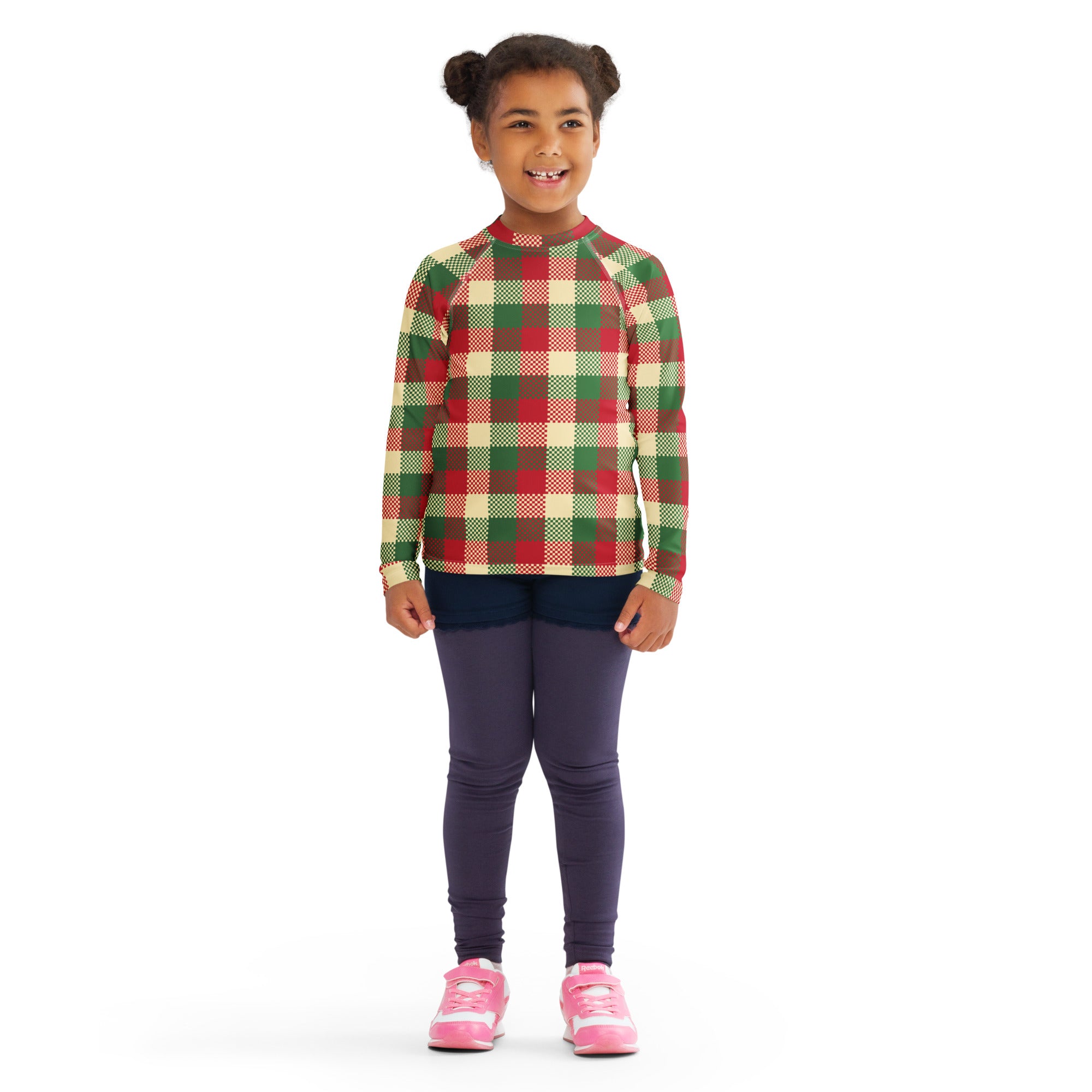 A child wearing a kids christmas plaid long sleeve rash guard swim shirt with upf 50 plus in red and green plaid