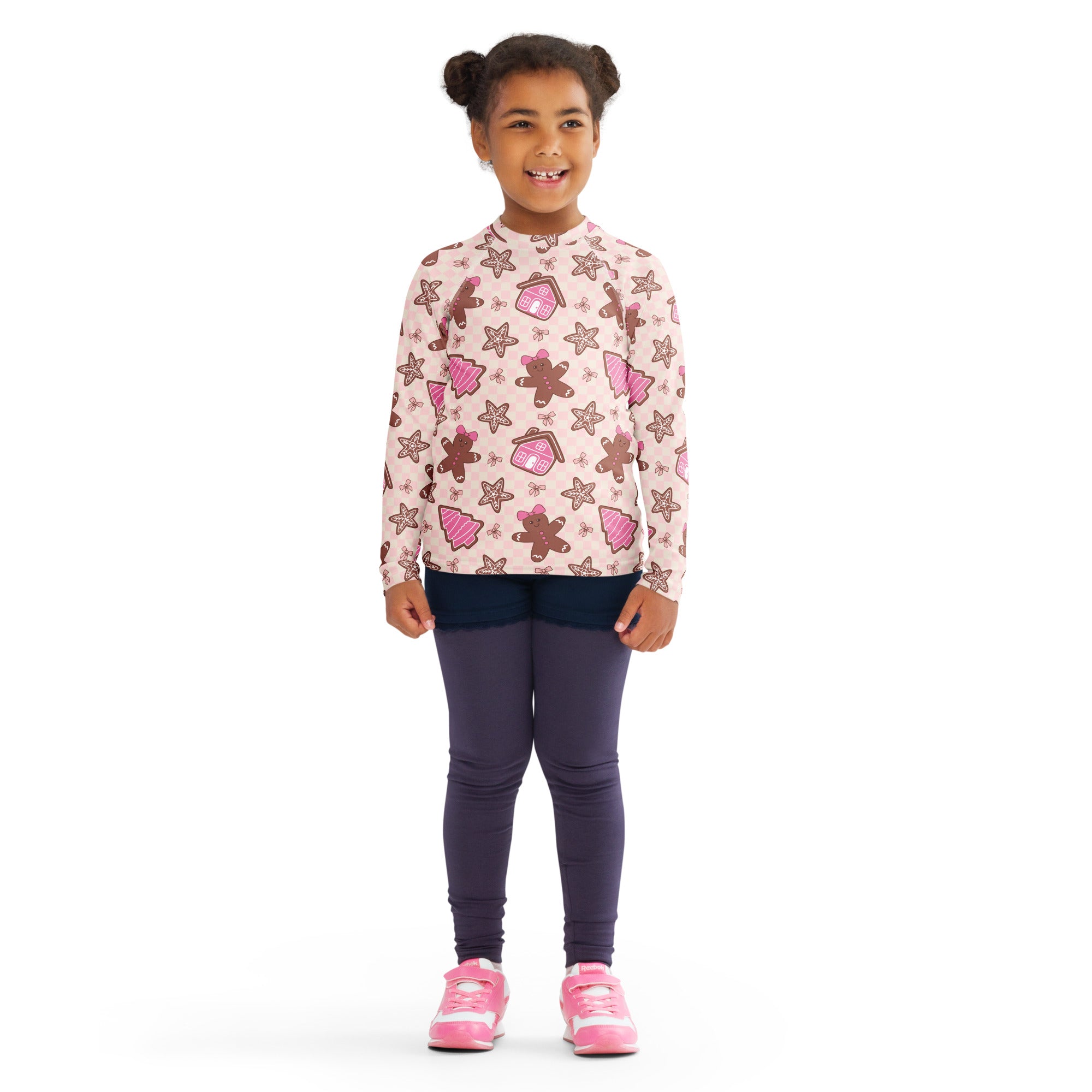 Kids pink long sleeve rash guard swim shirt with upf 50 plus featuring gingerbread men and christmas tree pattern