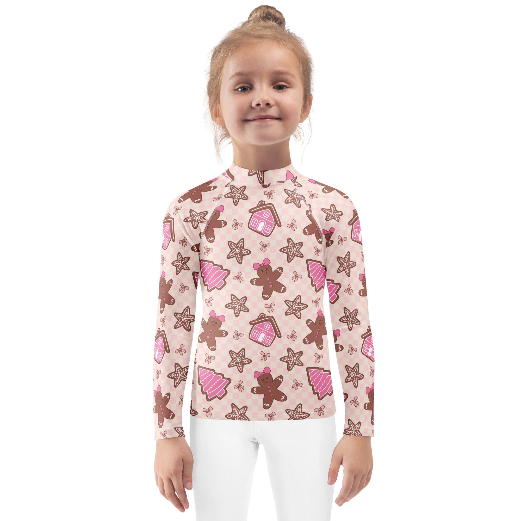 Kids pink long sleeve rash guard swim shirt with festive gingerbread house star cookie pattern and upf 50+ protection