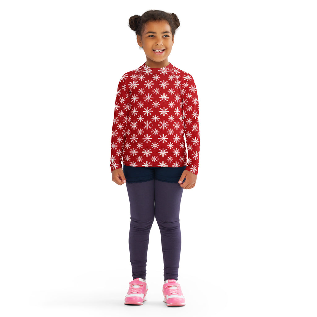 Kids red long sleeve rash guard swim shirt with white snowflake pattern and upf 50 plus for christmas protection