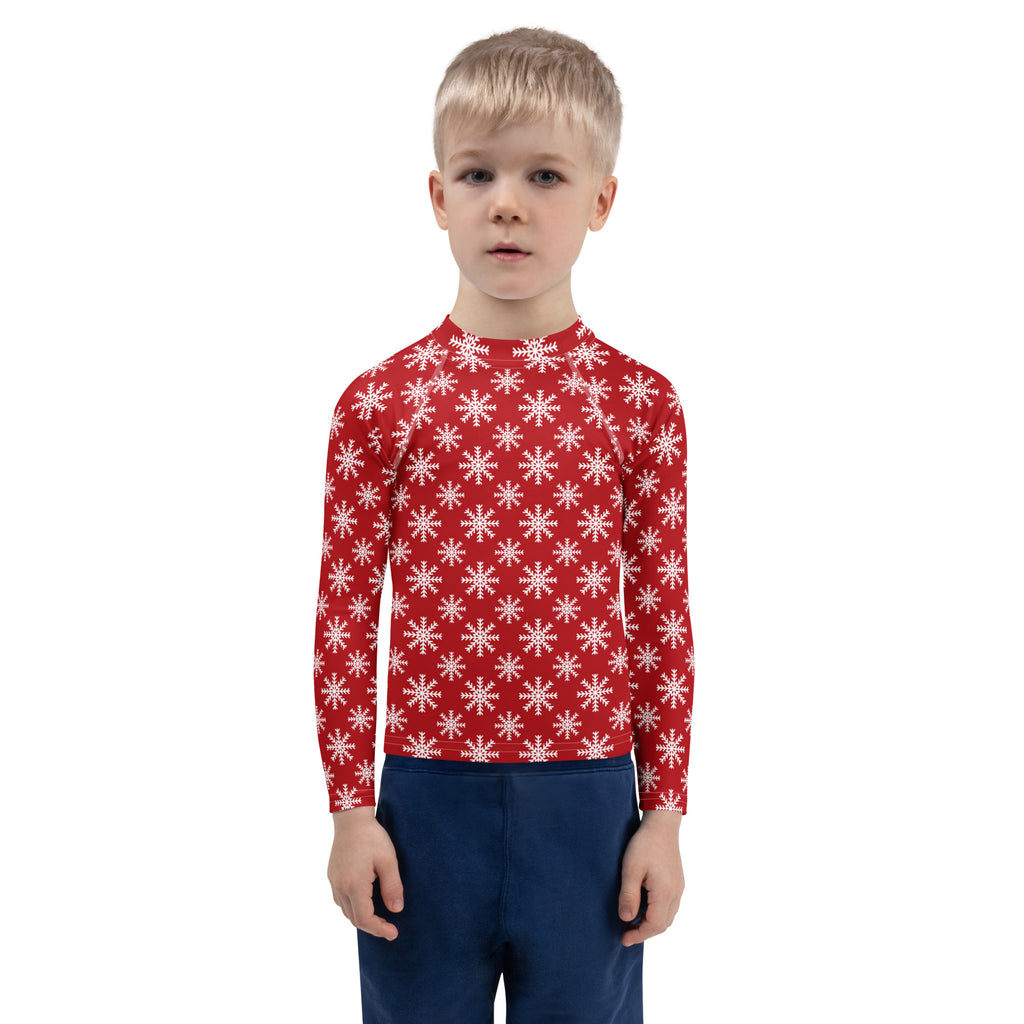 Kids red long sleeve rash guard swim shirt with white snowflake pattern and UPF 50 plus sun protection
