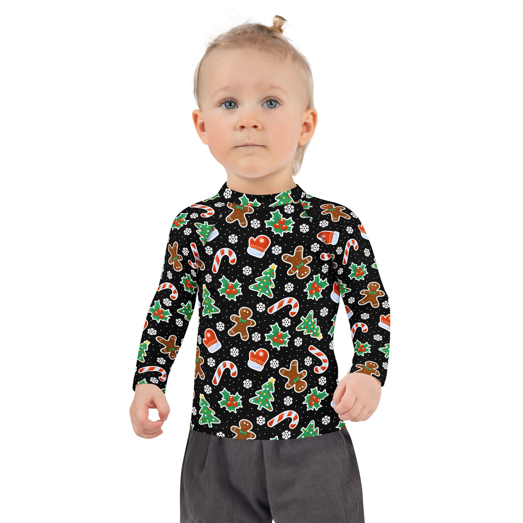 Kids black long sleeve rash guard swim shirt with UPF 50+ featuring festive gingerbread men candy cane and Christmas tree pattern