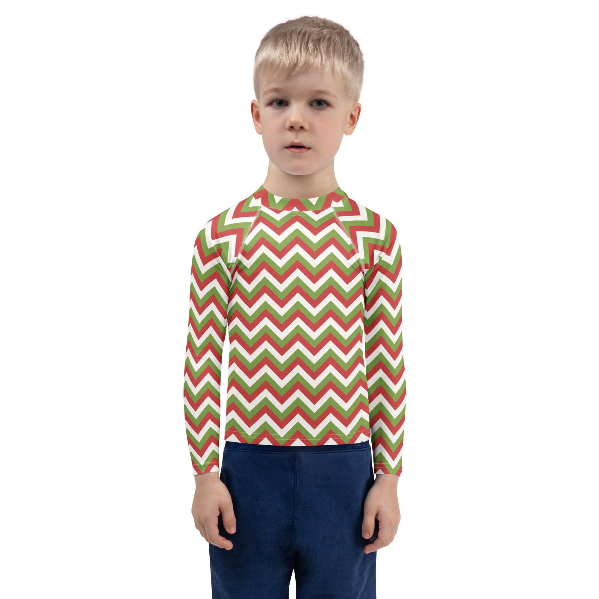 A child wearing a kids red and green chevron christmas long sleeve rash guard swim shirt with upf 50 plus