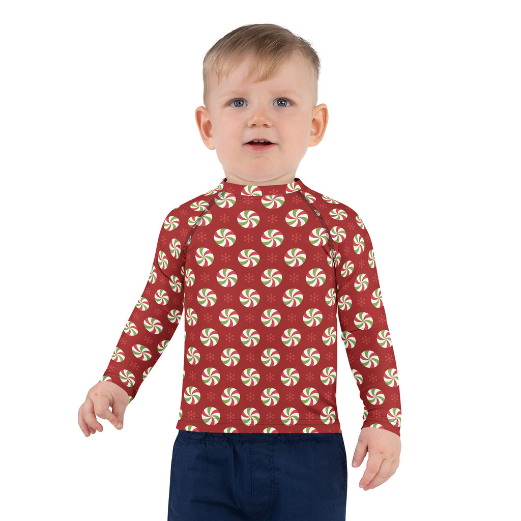 Red long sleeve kids rash guard with green and white peppermint candy pattern upf 50 plus swim shirt for christmas