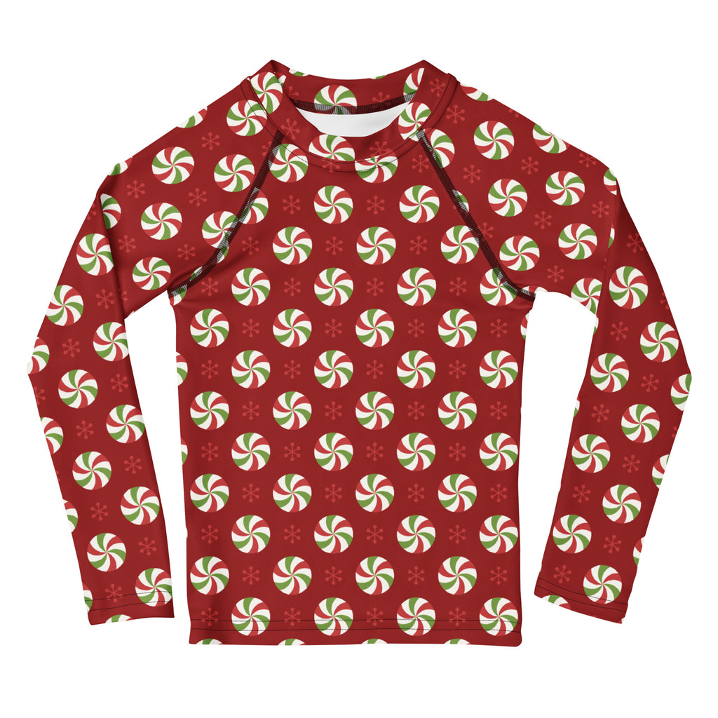 Red kids long sleeve rash guard with green and white peppermint candy festive pattern and UPF 50 plus sun protection
