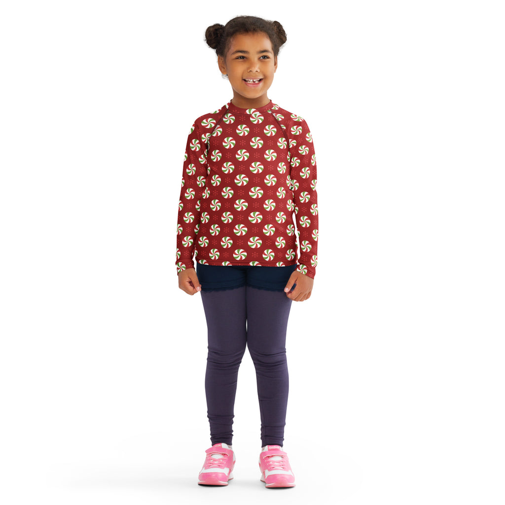 Kids peppermint swirl christmas long sleeve rash guard swim shirt with upf 50 plus red with white and green candy pattern