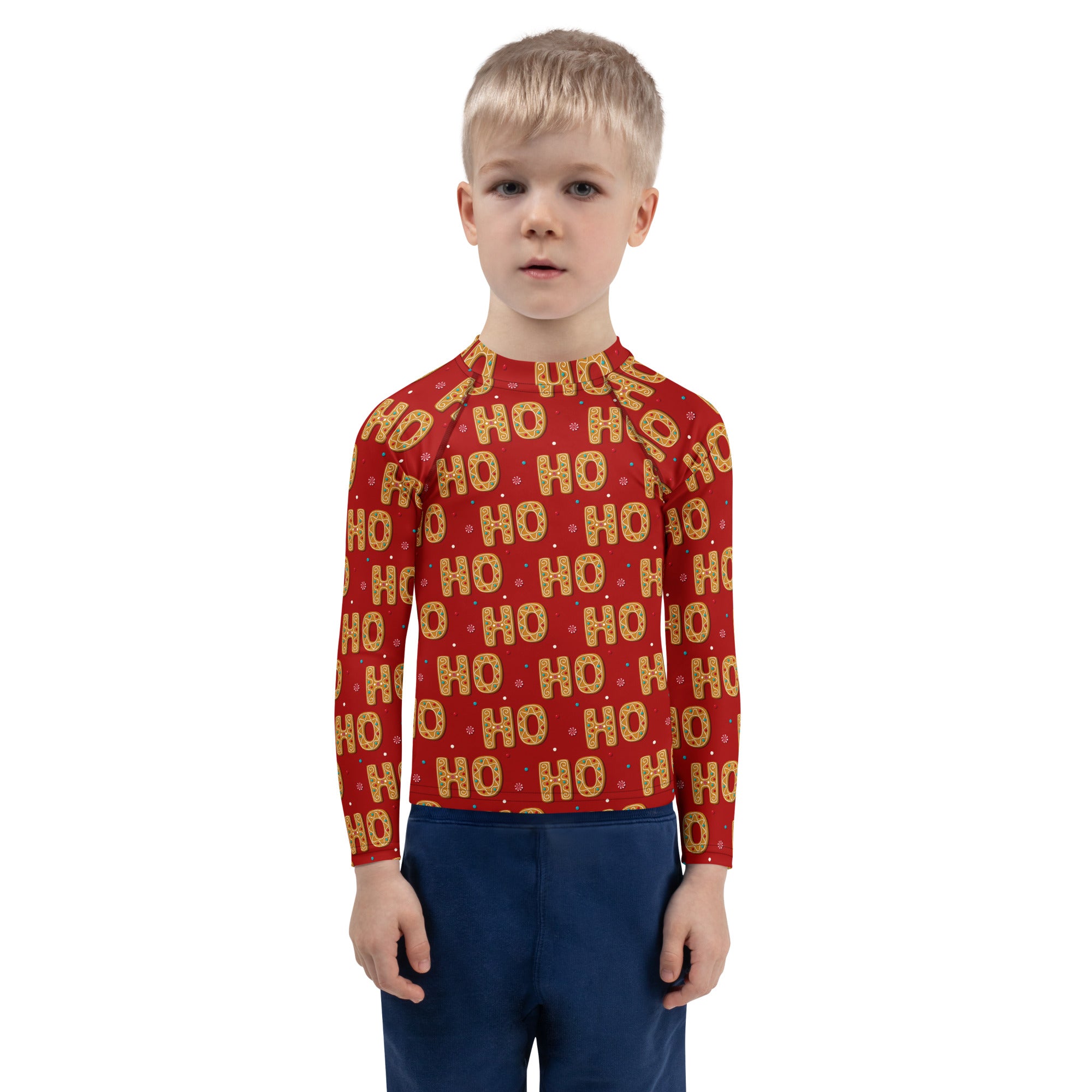 Kids red long sleeve rash guard swim shirt with gold ho ho pattern and UPF 50 plus for Christmas swim protection