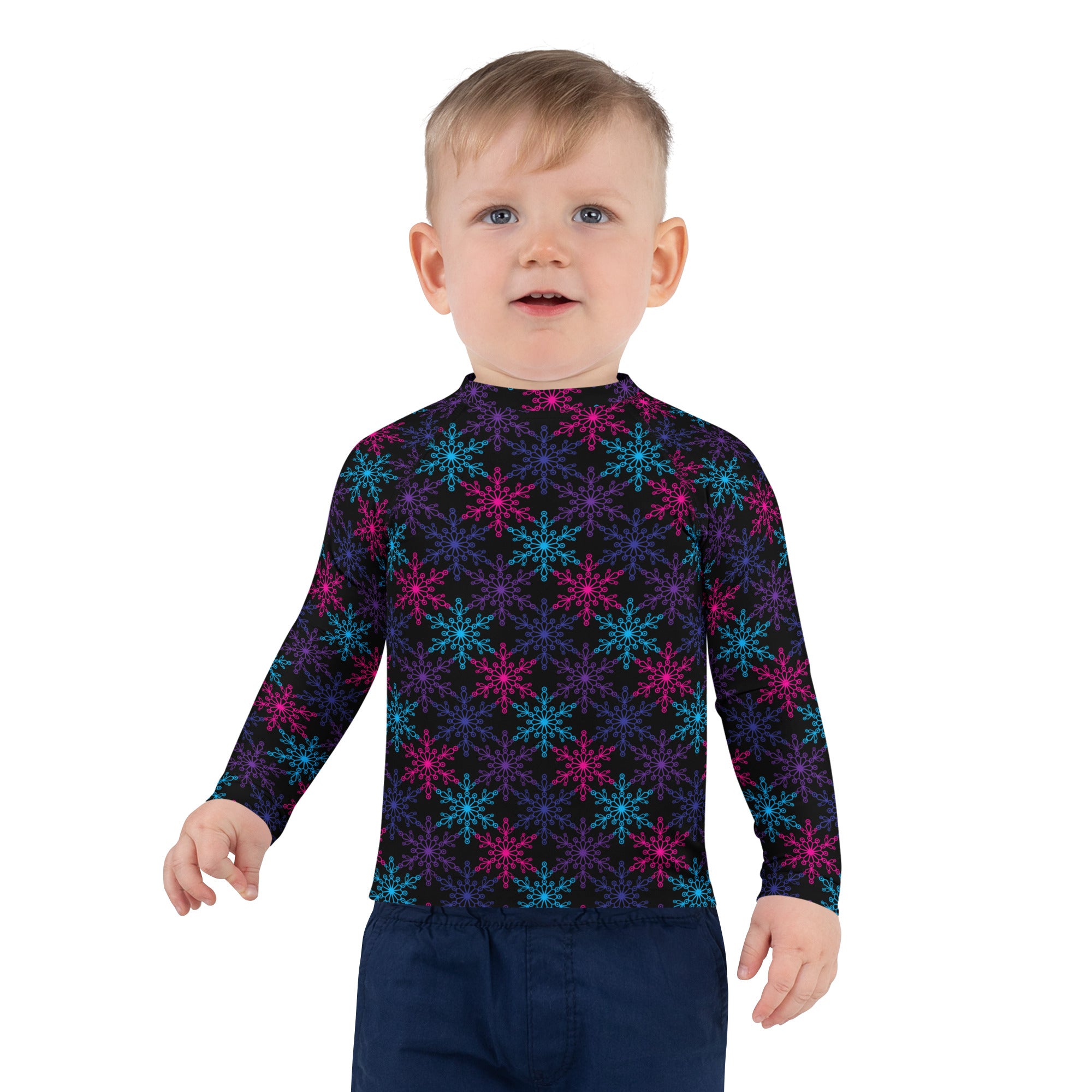 A child’s black long sleeve rash guard swim shirt with neon pink blue purple snowflakes and UPF 50+ protection