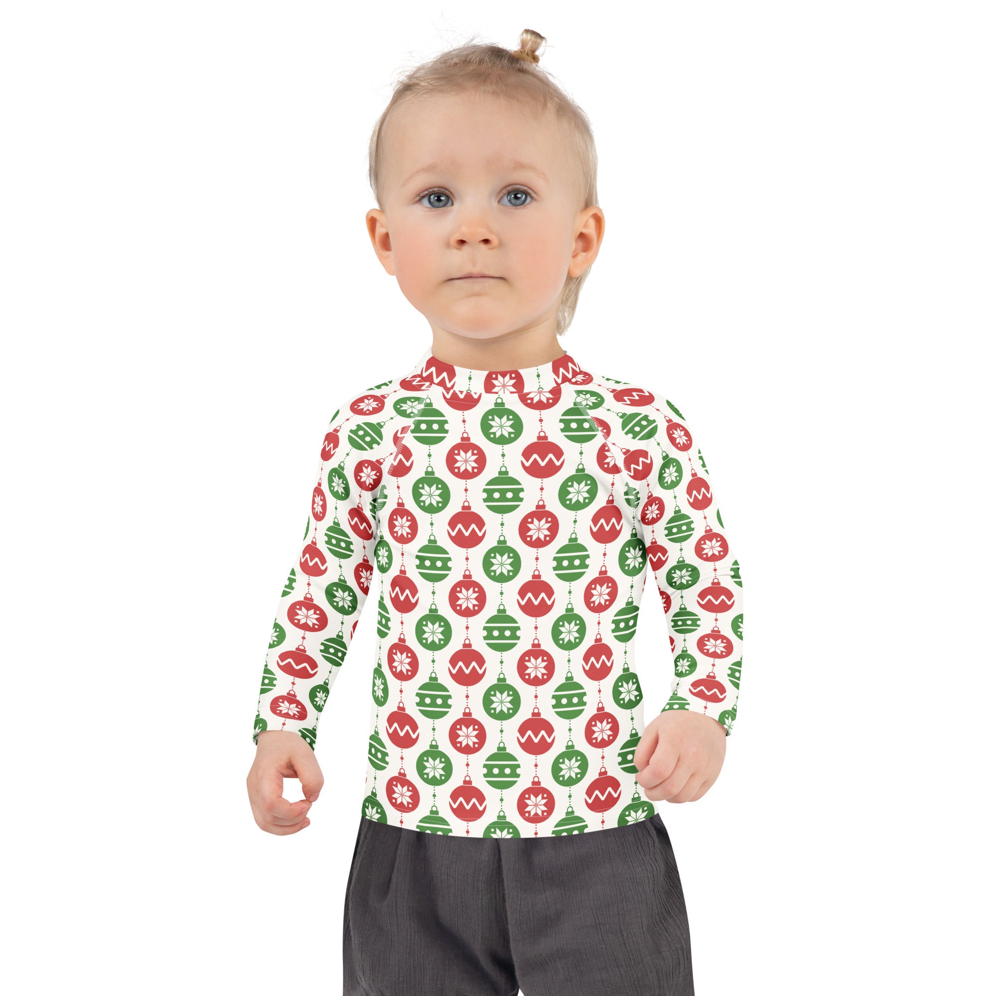 A child wearing a kids red and green christmas ornament long sleeve rash guard swim shirt with UPF 50+