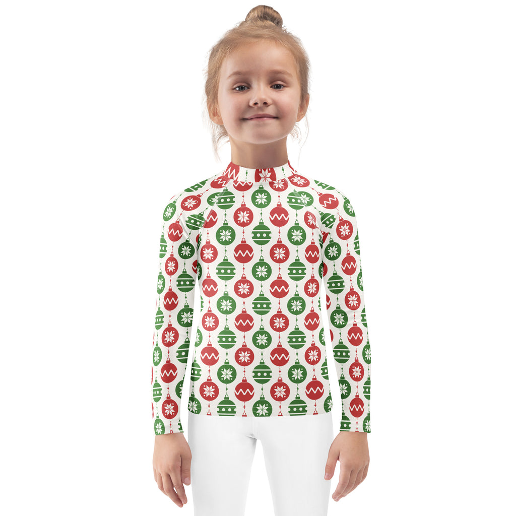 Festive kids long sleeve rash guard swim shirt with red and green christmas ornaments and snowflakes on white background