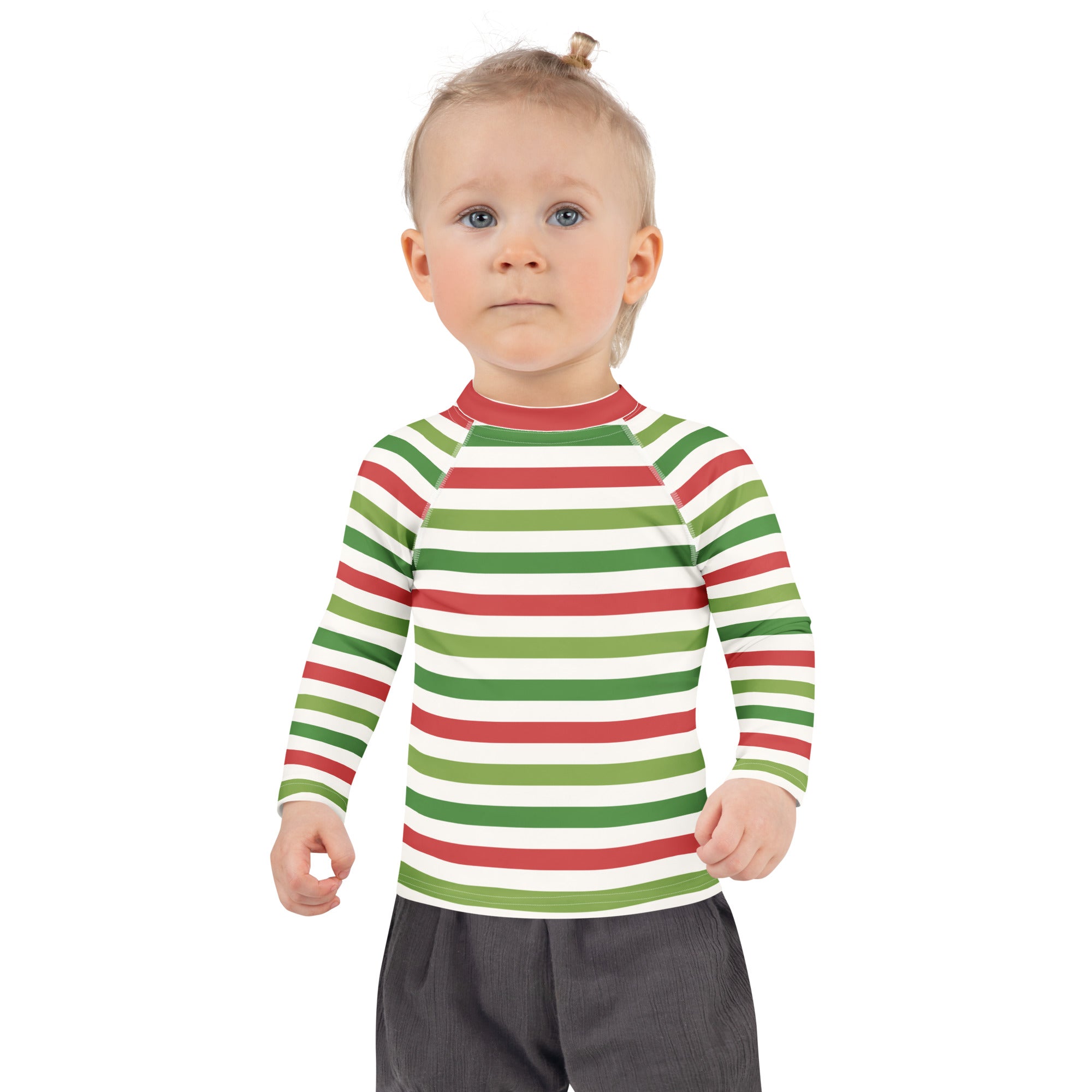 A child wearing a kids red and green christmas stripes long sleeve rash guard swim shirt with UPF 50+