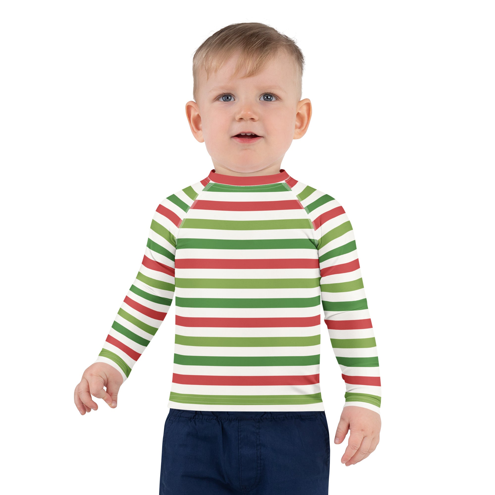 A child wearing a kids red and green christmas stripes long sleeve rash guard swim shirt with upf 50+