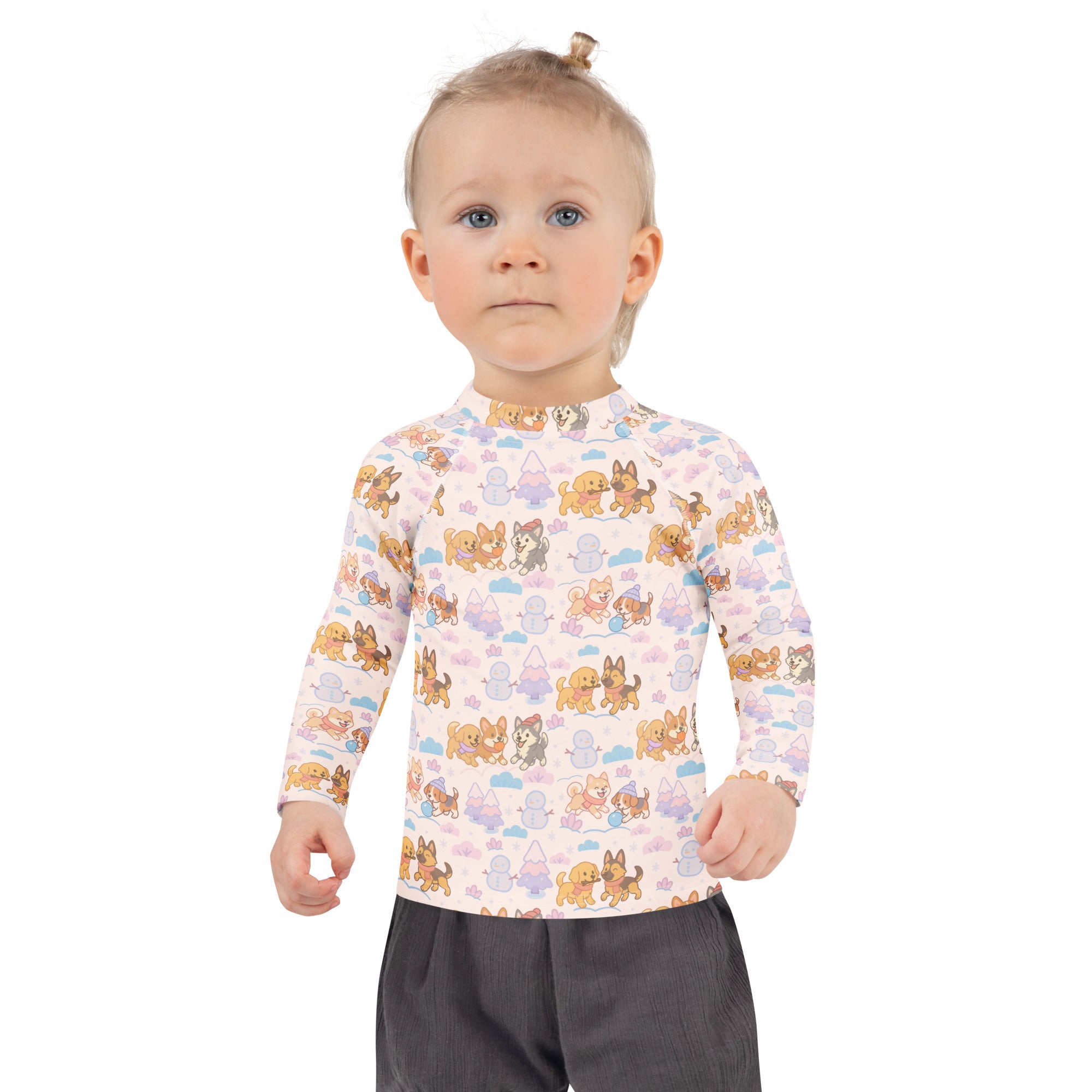 A child wearing a light pink kids winter dogs stripes long sleeve rash guard swim shirt with UPF 50+ and cartoon patterns