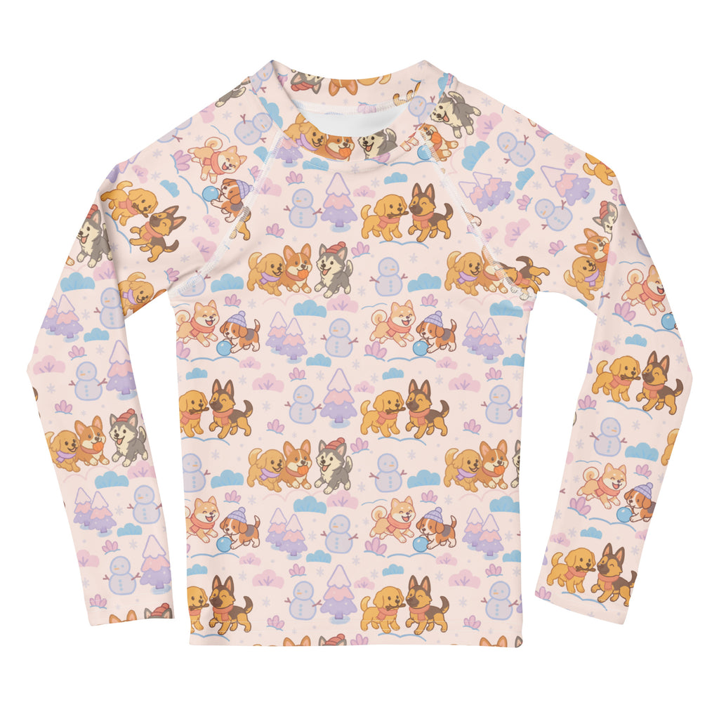 A kids long-sleeve light pink rash guard with playful cartoon dogs and snowy scene pattern with upf 50+ protection