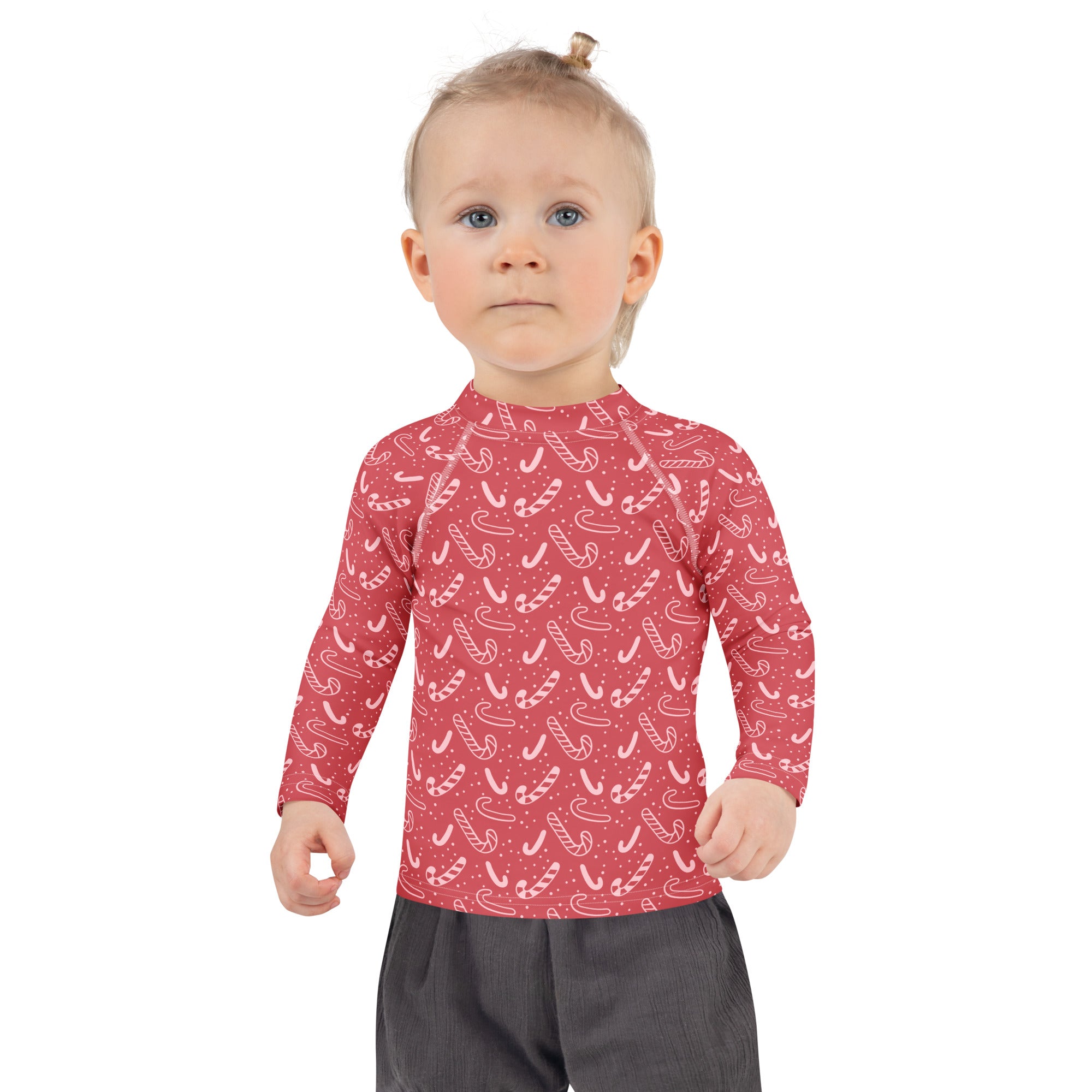Kids red long sleeve rash guard swim shirt with white candy cane pattern and upf 50 plus sun protection