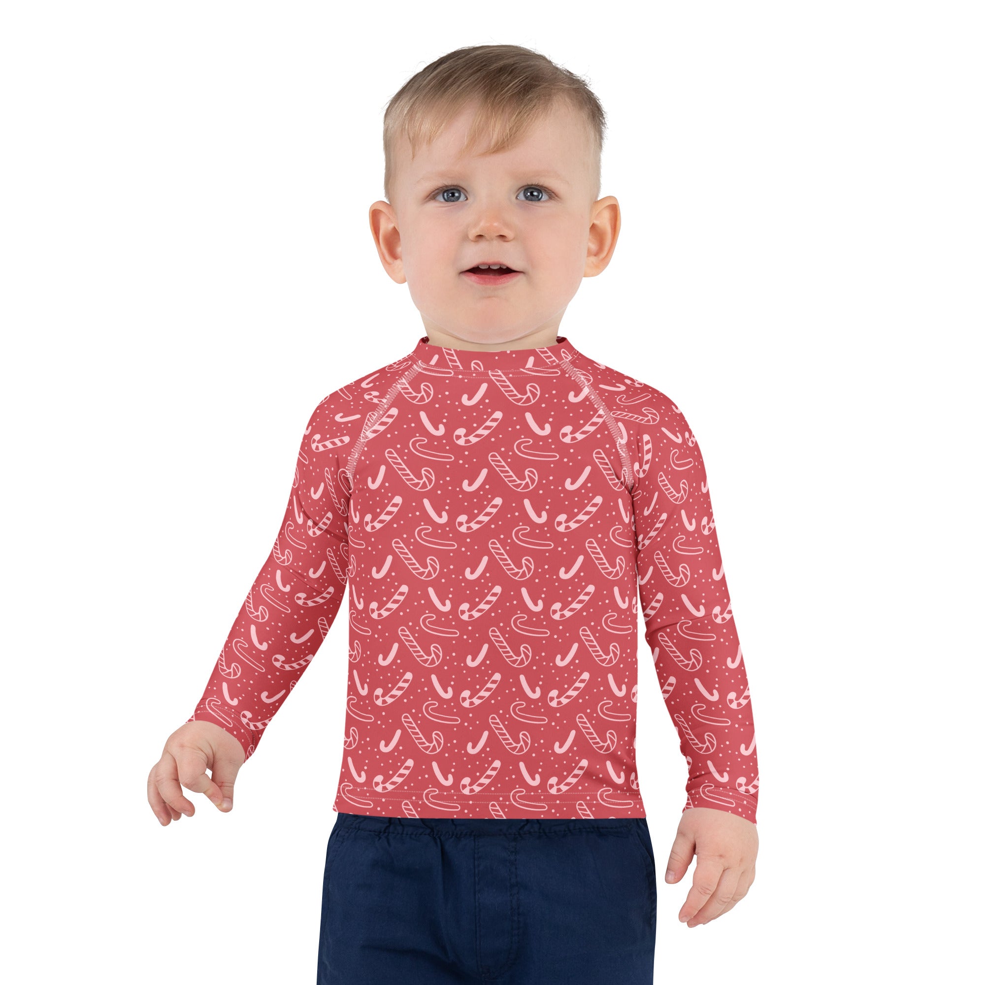 Kids red long sleeve rash guard swim shirt with white candy cane pattern and UPF 50 plus for Christmas protection