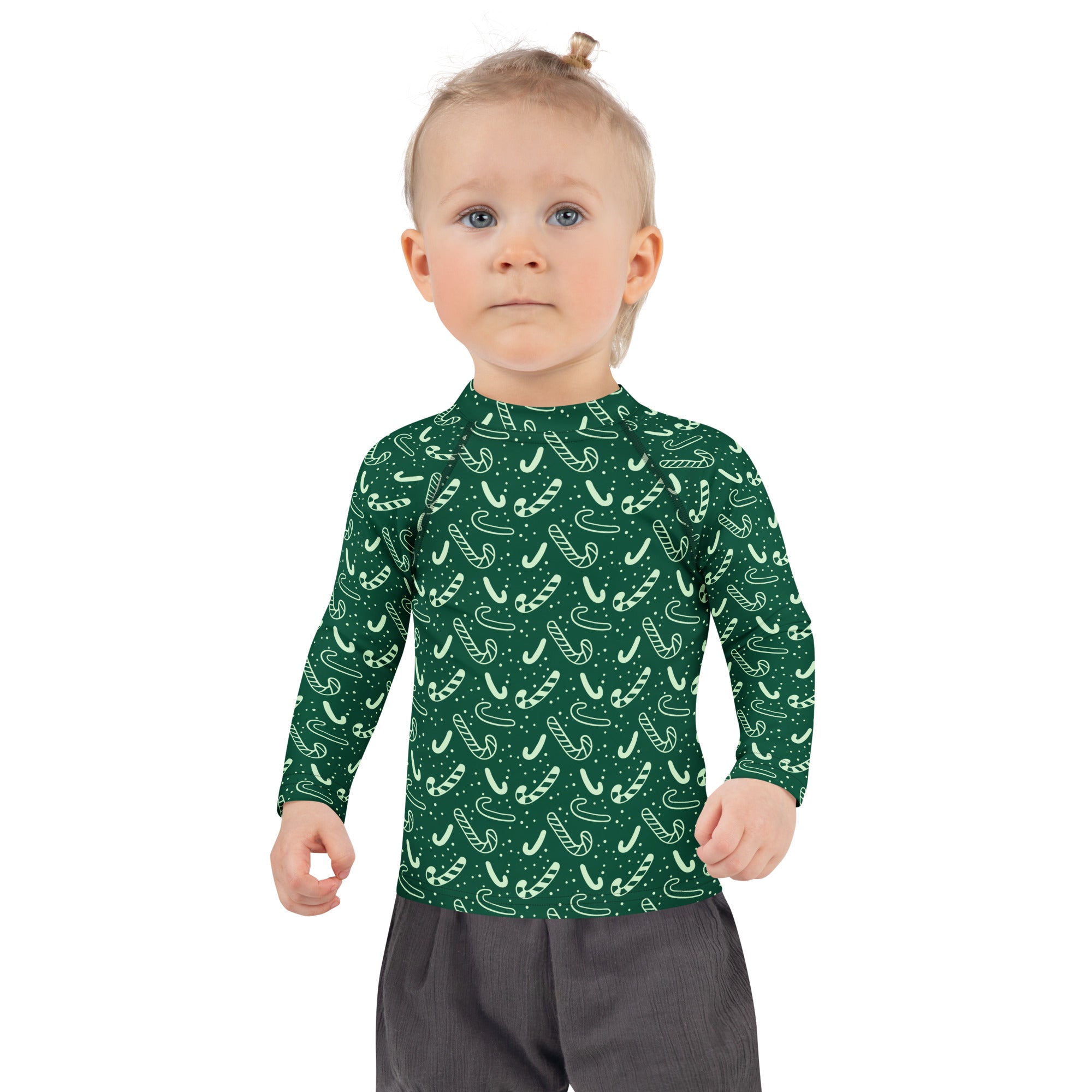 Kids green candy cane christmas long sleeve rash guard swim shirt with upf 50 plus in white pattern design