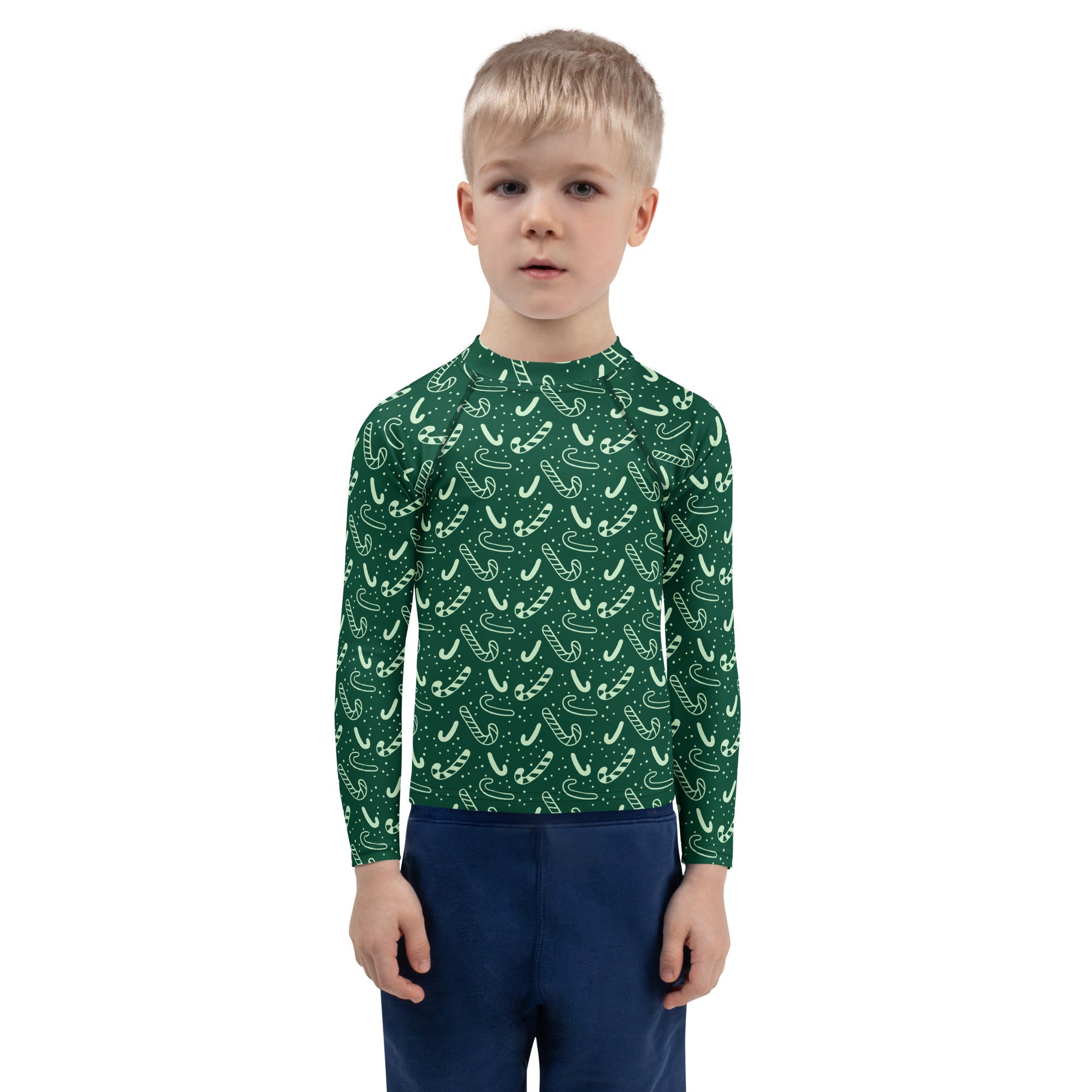 Kids green candy cane christmas rash guard swim shirt with long sleeves and upf 50 plus for sun protection