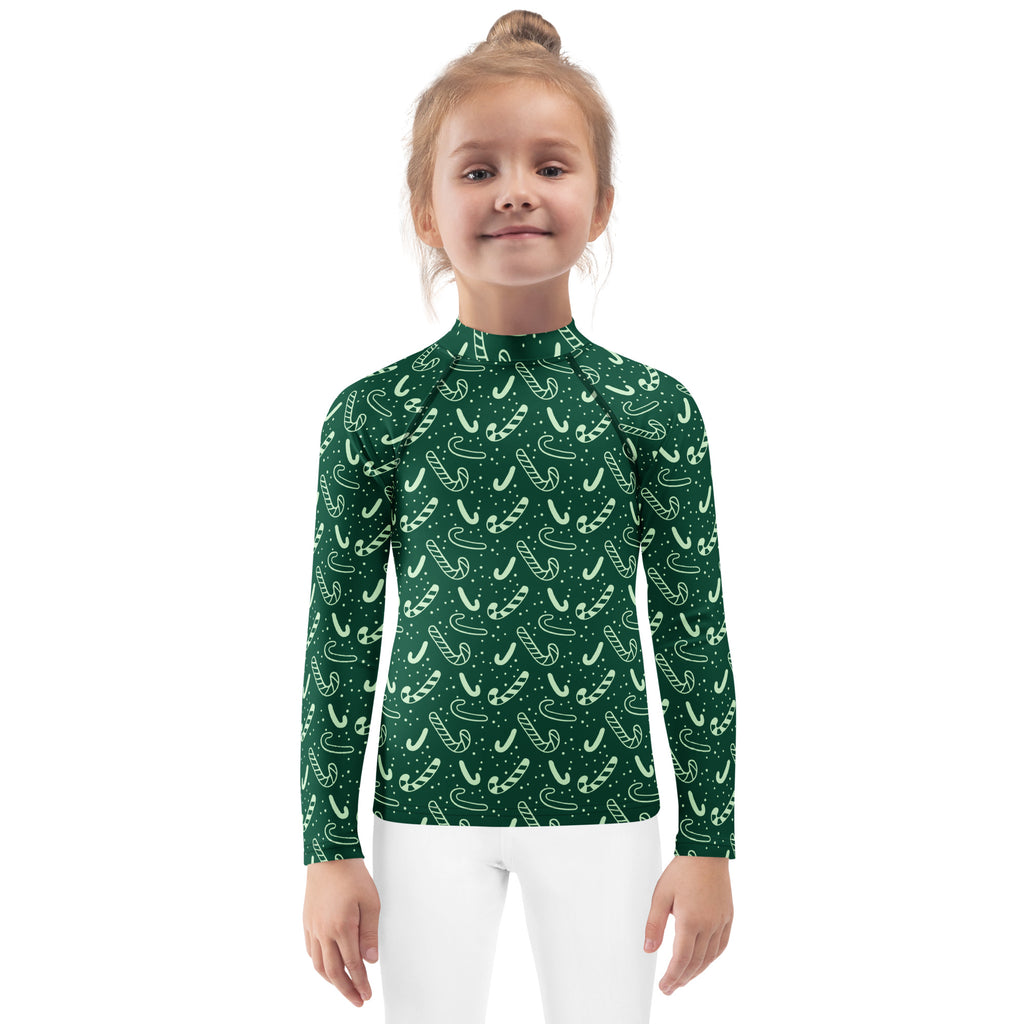 Kids green candy cane christmas long sleeve rash guard swim shirt with white patterns and upf 50 plus protection