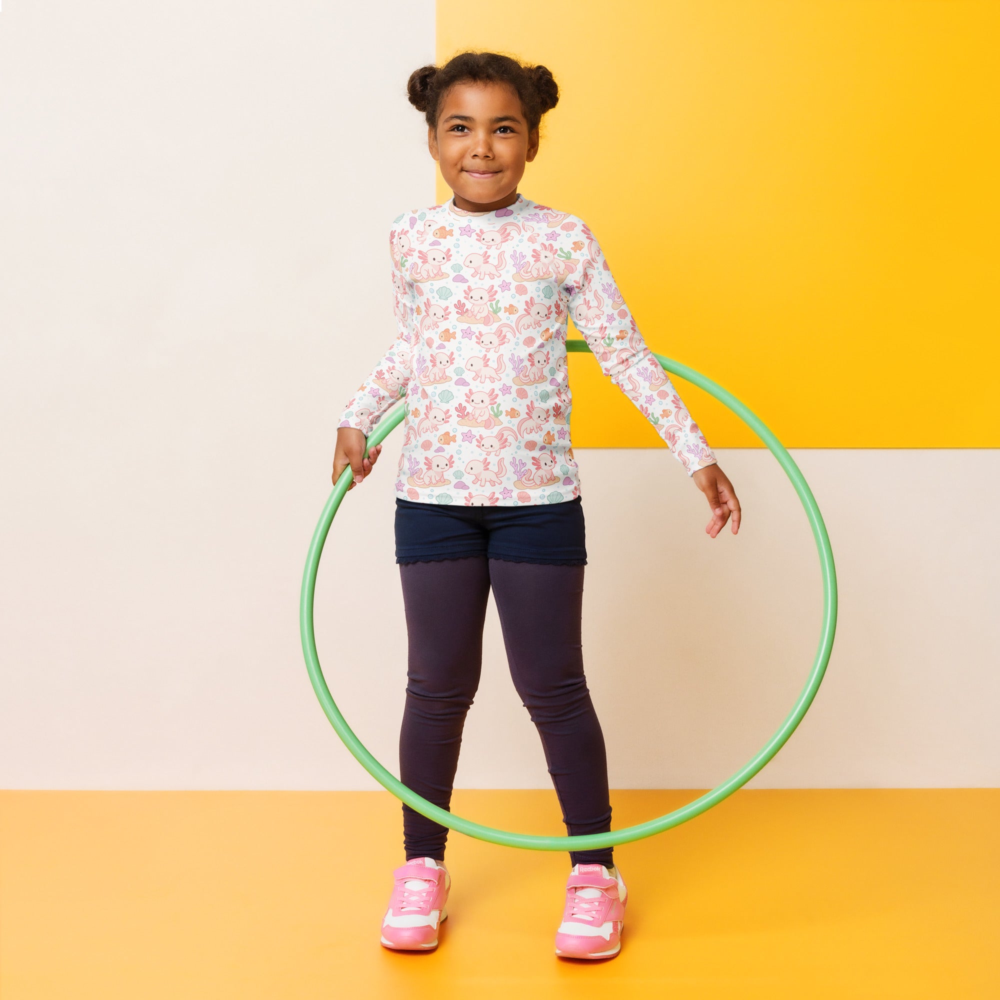 Green plastic hula hoop shown with girls axolotl long sleeve rash guard swim shirt with upf 50 plus