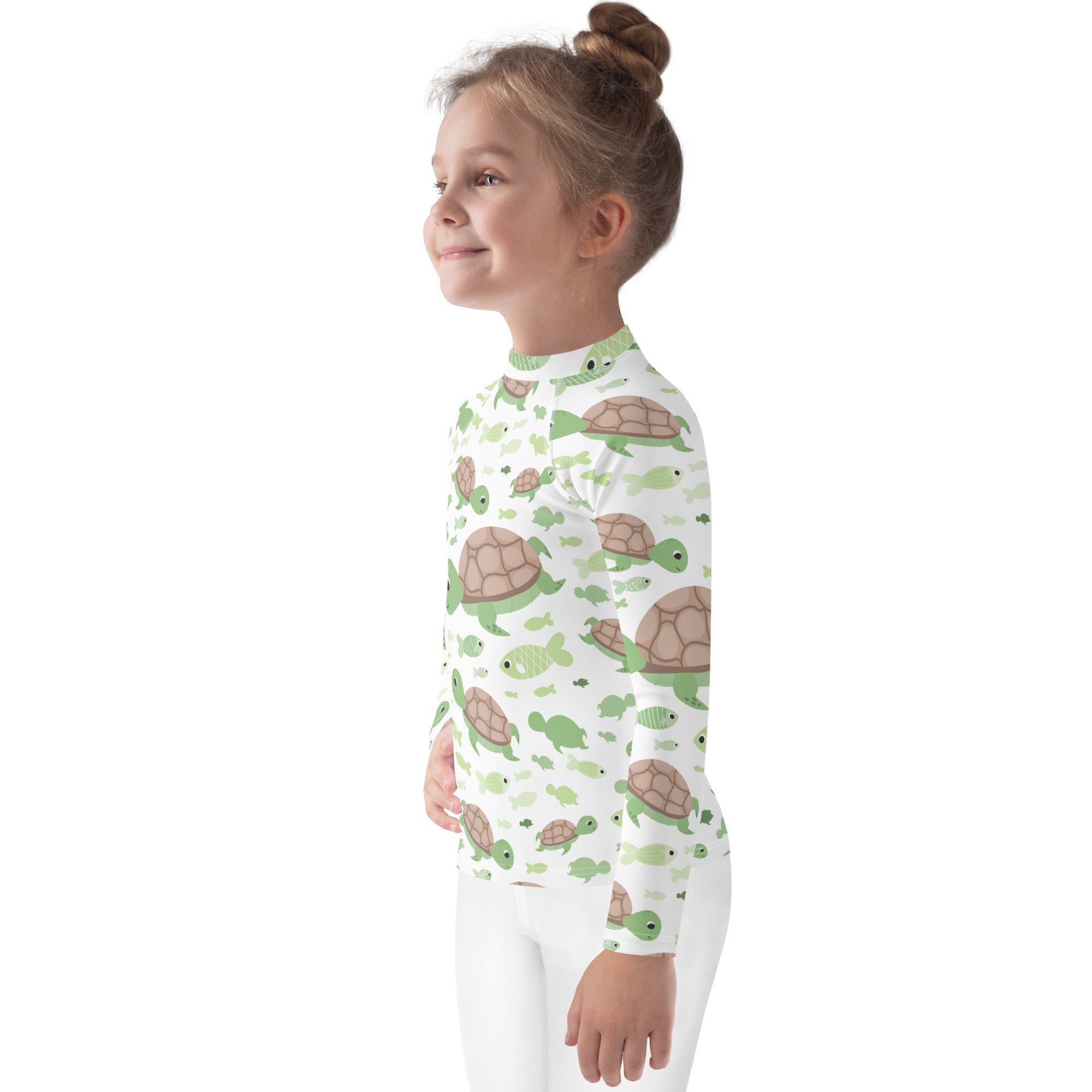 A child wearing a white kids green sea turtle long sleeve rash guard swim shirt with UPF 50+ and playful turtle pattern