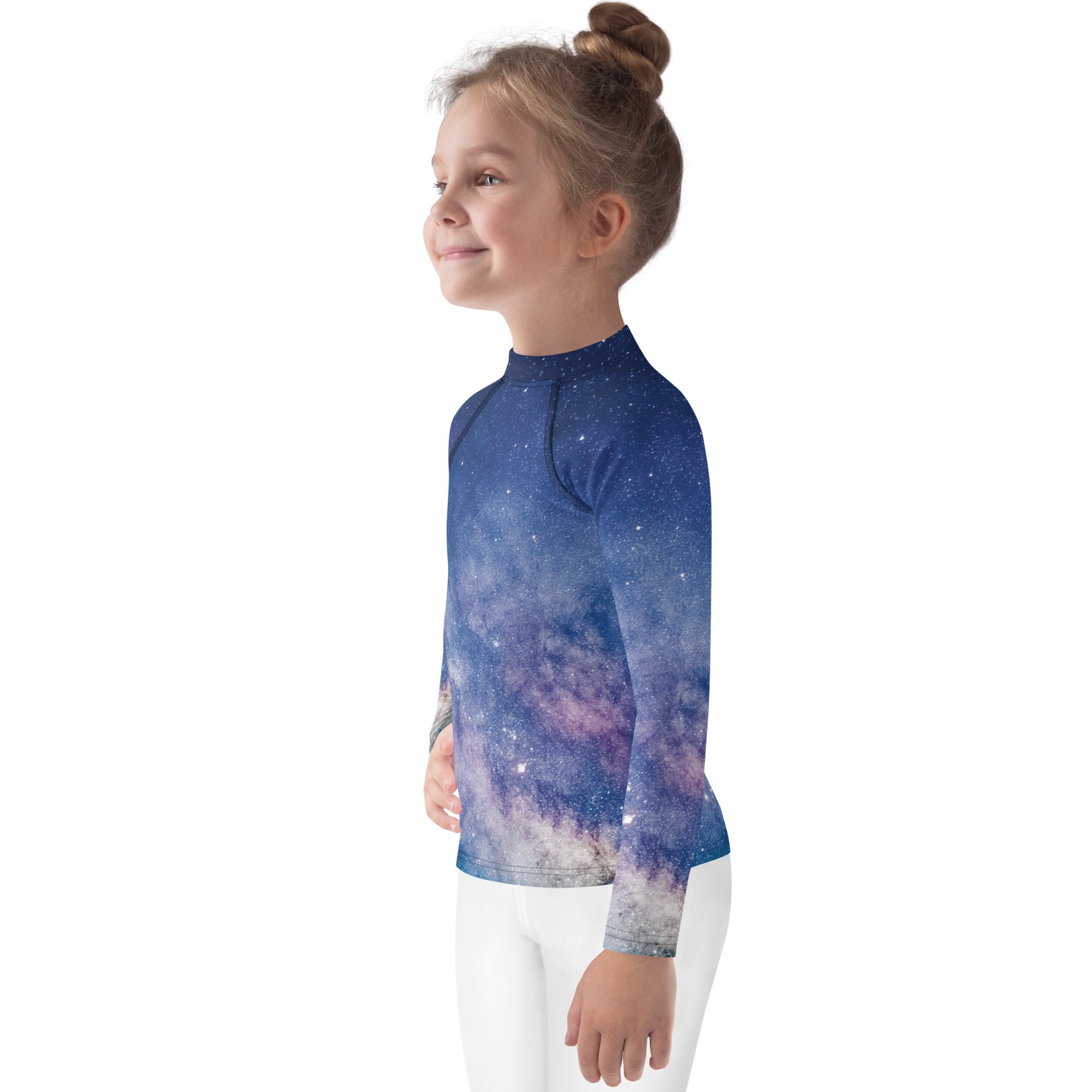 A child wearing a girls realistic galaxy long sleeve rash guard swim shirt with vibrant blue and purple galaxy print and upf 50+ protection