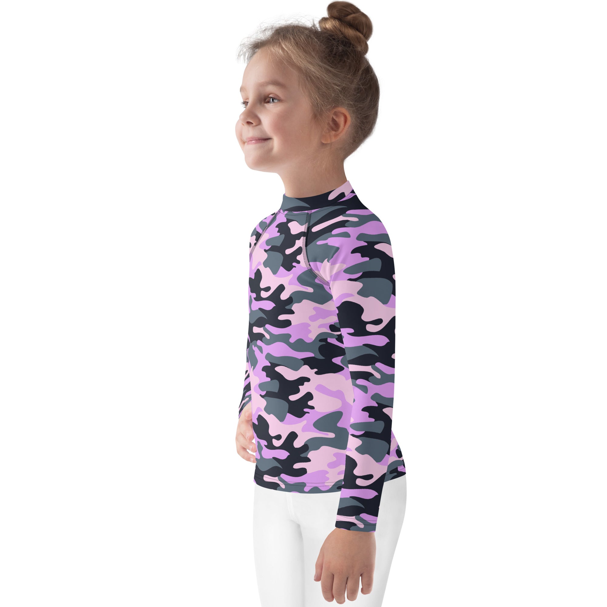 A child wearing a girls purple camouflage long sleeve rash guard swim shirt with vibrant pink and black pattern and UPF 50+