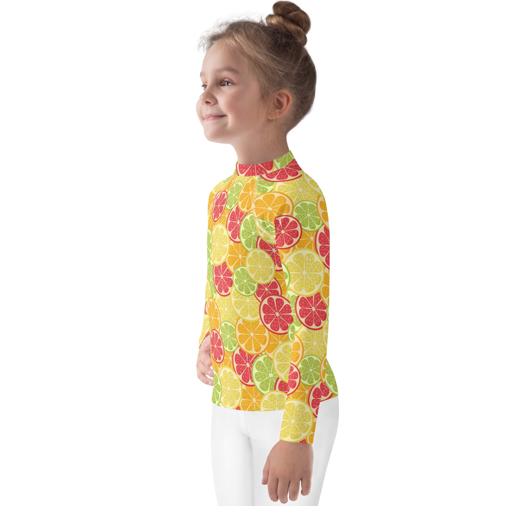 Kids citrus fruit long sleeve rash guard swim shirt in vibrant yellow with colorful sliced citrus pattern and UPF 50+ protection